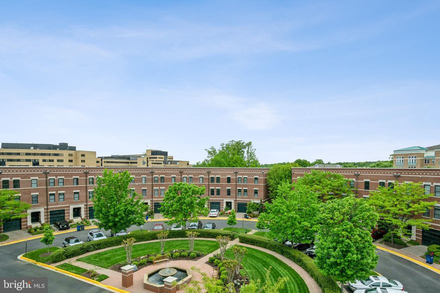 A perfect alternative to owning a single-family, with its location and all the 3 outdoor spaces this townhouse offers, the security it provides is cause for attention!!!  Come home to West Market Community! A rich collection of stylish townhome residences, located just across the street in the live-work, & play oasis, that is the Reston Town Center! West Market townhouses boast the best of both worlds, the charm of the traditional neighborhood and the walkability of a thriving urban-like lifestyle. Featuring the prestige of European architecture inside and out. The exterior facade consists of a mix of brick and stone and designer finishes throughout the interior of the house.  this 4 level home is situated in an East-West position, which offers an abundance of natural light in all the rooms! Hardwood floors throughout, this home hosts outdoor entertaining options with a rooftop terrace and a spacious patio off the kitchen. With the Rooftop terrace, you get a great skyline view and receive direct sunlight all year long even in the winter months! The 4th-floor  has an attractive built-in wet bar with a wine cooler and plenty of shelving space to display bottles or glassware, built-in surround sound system, and a gas fireplace, perfect for entertaining and fun! The master suite on the 3rd floor offers  2 walk-in closets, the items attached convey (TV and headboard). The Master bath has a double sink, a soaking tub, and a standing shower. The second bedroom is located on the same floor and it has a walk-in closet and its own bathroom. The washer and dryer closet is in between the two rooms. The main floor, the 2nd floor, has a great floor plan again with lots of light and connecting to the spacious balcony off the kitchen with the  patio furniture that conveys will be perhaps where you spend most of your time. The kitchen and dining areas Living room where you will be watching TV (which also conveys) are on this floor! The house was renovated in 2016 with many attractive features and colors everywhere and especially in the kitchen and living-dining room! The entry-level features the foyer, and the hallway that connects to the attached 1 car garage, full bath, and the 3rd bedroom with a walk-in closet, a TV that conveys, and a walkout to the patio.  Walk to bow-tie theatre, restaurants such as Barcelona Bar, Bar Taco, Morton's steak house, shops such as lululemon, Athleta, Apple store, CVS pharmacy, coffee shops, such as Pitango and Starbucks, live entertainment throughout the year, Ice staking rink for the winter months, festivals and local businesses and many commercial offices not to mention the access to walking trail and the W&OD trail, the new Reston metro stop, the Silver Line Metro, commuter routes, and Dulles Airport all within minutes away! Heat pump 2016. New 2021 water heater and furnace.  Bonus: Your Own EV Charger in the Garage!