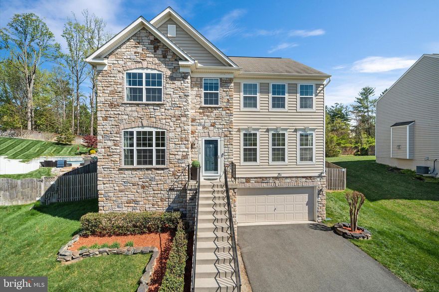 Pristine, three finished level colonial in popular Eagles Pointe!  Attractive stone front and manicured landscaping welcome you inside.  Gleaming hardwoods carry from the foyer through the dining room and spacious kitchen - Center island kitchen with granite countertops, stainless steel appliances, stylish tile splash, recessed & pendant lighting and 42" cabinetry - Breakfast area & breakfast counter - Family room off the kitchen w/ gas fireplace - Primary suite w/ tray ceilings, walk-in closet & private luxury bath - Spacious secondary bedrooms - Bedroom level laundry - Patio & gazebo overlook fenced backyard - Finished lower level w/ gorgeous bath - Ideal location minutes to 95 w/ easy access to Ft Belvoir and Quantico.