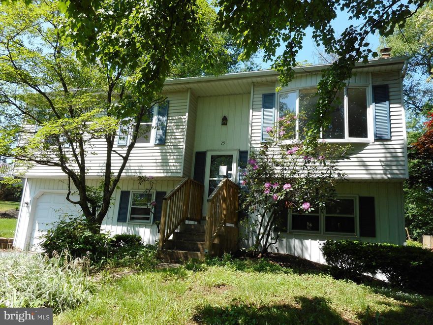 Split Foyer style home located in a park-like setting yet close to I-83. This property features 3 bedrooms, 1 1/2 baths, kitchen with oak cabinets and all the appliances stay. Pull down attic stairs in the hallway. The master bedroom has His & Her closets and has access to the hall bath. Lower level rec room with a wood stove and French doors to access the back patio, hot tub and back yard. Large laundry room with a half bath. The back yard utility shed stays. Property needs updating and is being sold in AS IS condition. Seller will make no repairs.  Easy to show.