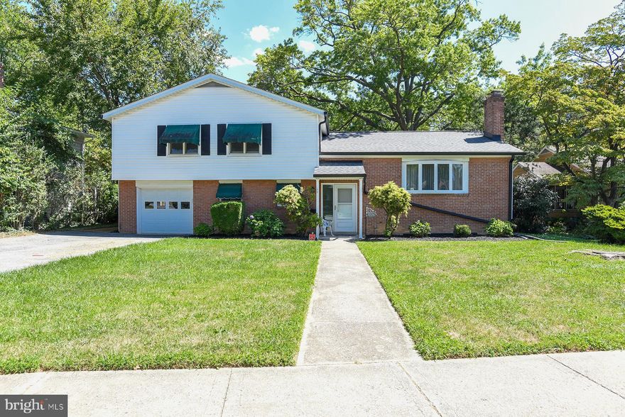 Welcome to this beautiful 5-bedroom split-level home in the highly sought-after Spring Valley community! Offering over 3,700 sq. ft. of thoughtfully designed living space, this home provides the perfect blend of comfort, character, and functionality. The highlight of the home is the impressive 21' x 30' sunroom addition, boasting vaulted ceilings, a cozy woodstove, and walls of windows that bathe the space in natural light while offering serene views of the level, fenced backyard—an entertainer’s dream and an ideal retreat for year-round enjoyment.  Step inside to find warm hardwood floors, central A/C, and efficient natural gas heating. The main level includes a spacious dining room and an inviting kitchen with abundant cabinetry, all appliances included, and convenient walk-out access to the backyard for seamless indoor-outdoor living. Upstairs, the private primary suite features its own full bath, while three additional bedrooms and another full bath provide plenty of room for family and guests. The lower level offers even more living space with a comfortable family room, an additional bedroom, and a half bath. An unfinished basement with walk-up access to the yard ensures ample storage or future expansion potential.  Outdoor living is equally enjoyable with a brick patio, perfect for barbecues and gatherings, and a fenced backyard for recreation or pets. A one-car garage and a long driveway add convenience and practicality. Ideally located near schools, shopping, restaurants, parks, and major commuter routes including I-70, this home is perfectly positioned for both everyday living and entertaining.  Don’t miss this rare opportunity to own a spacious, versatile home in one of the area’s most desirable neighborhoods—Spring Valley!