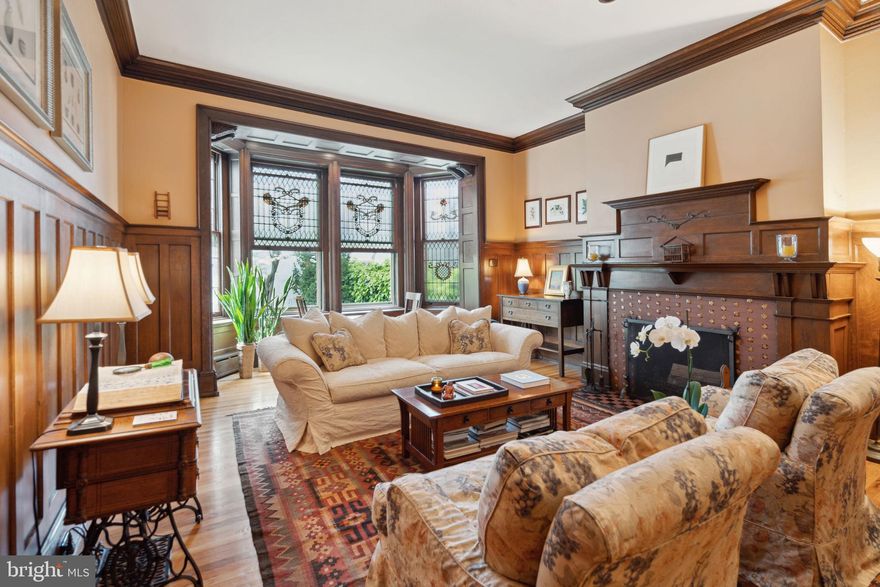 Built in 1890 by renowned architect Frank Miles Day, this impeccably restored and updated Arts and Crafts style brownstone and brick home features a dramatic open floor plan, stained glass windows, detailed moldings, and ten and a half foot high ceilings. With 4,241 square feet on five floors, the historic home has two wood-burning fireplaces, original Mercer tile, and meticulous renovations that were done to maintain the original craftmanship and style.  This beautiful, one-of-a-kind light-filled home has five bedrooms and four and a half bathrooms, a dining room, family room, and a large eat-in chef’s kitchen with top of the line appliances and French doors that open onto the patio and landscaped garden. There are two primary suites, a 2nd floor laundry room, and three additional spacious bedrooms, all with large closets. Built on an extremely deep 125 foot lot, the home has a detached one-car garage with loft storage and a garden gate that open onto Waverly Street. The top floor with exterior door opens onto a flat roof that can easily accommodate a roof-top deck. There is two-zone central air-conditioning, abundant storage, and all just steps to Rittenhouse Square.
