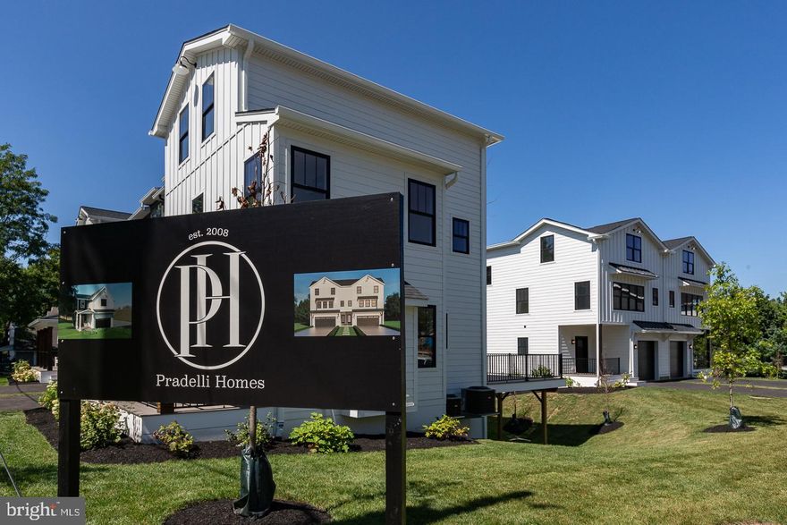 Welcome to The Enclave at St David's. This home is Built and Move In Ready. 993 Fairview Avenue is part of nine new construction residences in a private enclave near the heart of downtown Wayne.  A collection of eight carriage homes and one single-family home, they feature spacious interior living with thoughtful finishes throughout. Live effortlessly between the sanctuary of home and the vibrancy of downtown Wayne’s thriving restaurant scene. This beautiful carriage home has 3248 square feet of living space. Five bedrooms, three full baths, and two half baths. The first floor features 9 foot ceilings in the open concept kitchen, dining, living room. A perfect spot to entertain friends and family. Off of the dining room you’ll find your outdoor entertainment area. A sprawling 375 square-foot deck that overlooks the beautifully landscaped community. On the second floor the large primary suite is flooded with natural light. The primary en suite includes a wet room with shower, hand shower and soaking tub. The walk-in closet completes the space. Two additional bedrooms, full bath, and laundry space complete this floor. Walk up to the third-floor for two additional bedrooms, full bath, as well as two bonus rooms. Home office, TV room, playroom, game room. Take your pick. On the lower level, you’ll find a large living and entertaining space. Large enough for a TV area, bar, and even a pool table. From this space you can walk out to your ground floor patio and back yard. James Hardie siding, black Andersen windows, Azek Vintage Collection decking, Shaw Couture white oak wide plank flooring, GE profile appliances. Located in the award-winning Tredyffrin Easttown school district. Close to the train station, freeways, and King Of Prussia shopping and dining. Don’t miss this opportunity to live in a beautiful new construction home, in a top school district in the state, close to all of the amenities that Wayne has to offer. This home is built and move-in ready. All you have to do is pack your bags. Taxes TBD. This development is 90% completed and no exterior construction.