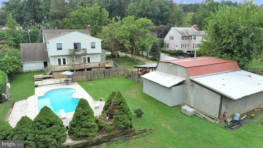 WOW,  take a look at this amazing home on a 3/4+ acre landscaped lot close to shopping, restaurants and so much more. The expansive back yard and deck overlooks a beautiful in-ground pool. Once you step inside you'll find 6 bedrooms and 4 bathrooms featuring a finished basement with a separate entrance and bathroom which could be utilized as an apartment or in-law suite.   The main level studio is accompanied by a full bath and could also be utilized as a small apartment or in-law suite.  Upstairs has 4 large bedrooms, including an en-suite primary bath with a private deck.  Wood burning fireplace in the living area. Upgrades and Updates include: Chimney recently inspected, replaced the damper, new flue, and cap. Pool Pump replaced in 2019 and a new roof in 2018. Additional large two-story barn with power and bathroom near the pool area. A spectacular circular driveway provides ease for multiple vehicles for all those pool events you'll be having at this fabulous property!  Home is being sold "As-Is".