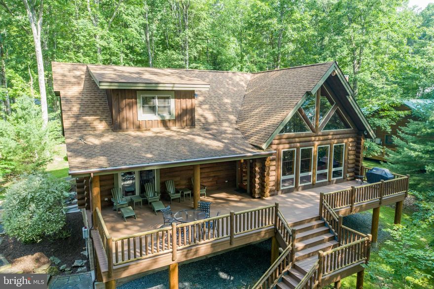 Your dream log lake retreat!  This 3 BR, 2.5 bath Yellowstone log home is the perfect place to get away and relax.  The property has had one owner over the past 39 years and has been preserved to promote everything special about Deep Creek Lake!  The 12 year old log dwelling includes an open floor plan with a masonry fireplace and ready to finish basement.  The property will also be sold with 2 additional lots across the street including 2.5 acres.