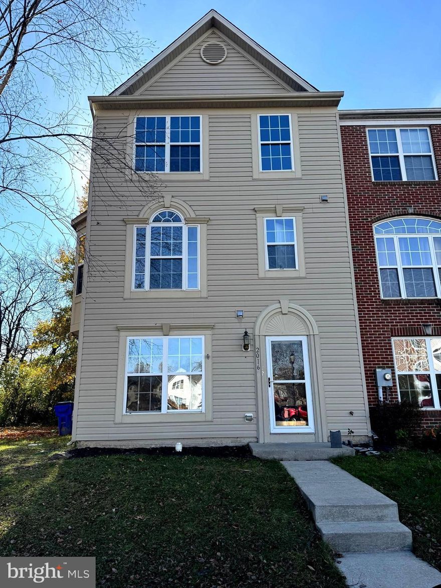 Beautiful, spacious end-unit townhouse featuring three levels and bump-outs on each floor. It offers 4 bedrooms and 3.5 bathrooms. The gourmet kitchen includes an island, upgraded cabinetry, and recessed lighting. A bright breakfast/sunroom with wood floors provides a cozy space with access to a nice deck. The lower/main level also includes a den or 4th bedroom with a full bathroom. The expansive recreation room features a gas fireplace. The primary suite boasts a walk-in closet and a luxurious garden bath with ceramic tile. This end unit has two bay windows in the family room, bringing in plenty of natural light and enhancing the space. The fenced backyard includes a concrete patio, perfect for outdoor relaxation.
