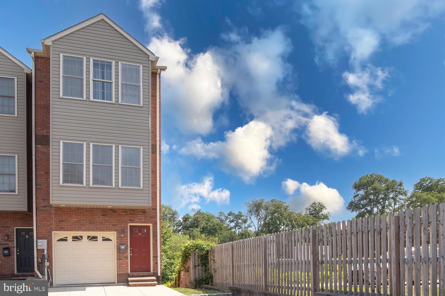 Discover this absolutely gorgeous 3-bedroom, 3 full bathroom end-unit townhome in the highly sought-after Wissahickon Walk—just minutes from the vibrant heart of Manayunk! Flooded with natural light and loaded with upgrades, this stunning home offers style, comfort, and flexibility in an unbeatable location. The foyer provides direct access to your one-car garage. A spacious first-floor bedroom and full bath create the perfect guest suite, while the finished walk-out lower level offers endless possibilities—home office, gym, playroom, or media room. Upstairs, rich cherry hardwood flooring flows through the open-concept main level. The gourmet kitchen features beautiful cabinetry, sleek stainless steel appliances, a granite island and wrap-around countertop with a tiered ledge for seating. Sliding glass doors off the dining area lead to a large private deck—ideal for morning coffee or evening gatherings. The bright living room, enhanced with recessed lighting, completes the perfect entertaining space. The next level features a primary suite with double closets and a spa-like ensuite bath boasting double sinks and a walk-in tiled shower. Another spacious bedroom, highlighted by a charming Juliet balcony, has access to a full hall bath. A convenient laundry area completes this floor. In addition to the garage, this home also includes driveway parking and an assigned guest spot. Ideally located near Fairmount Park, bike trails, Center City, public transportation, top-rated restaurants, museums, and so much more This is the one you’ve been waiting for—schedule your tour today!