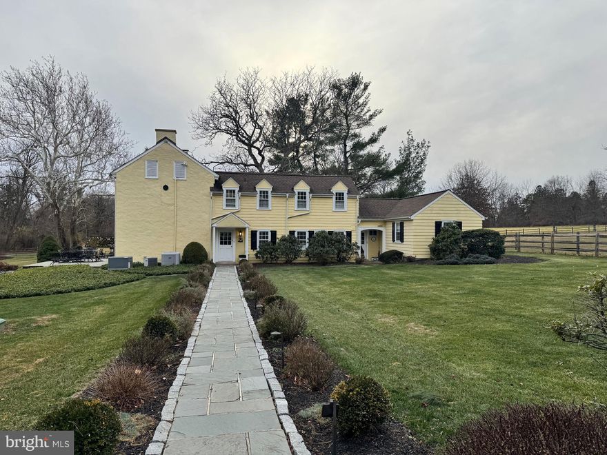 A Remarkable Rental Opportunity in the Heart of Blue Bell: Accessed by a long, gated drive and surrounded by wide-open fields, tall trees, and quiet views of horses grazing nearby, this charming 6 Bedroom, 3.5 Bath stone colonial offers more than 3,200 square feet of character and comfort, with gleaming, refinished hardwood floors throughout. Beautifully situated on 1.61. acres, in one of Blue Bell’s most picturesque locations, this property, with inground, heated pool and detached 2 car Garage with Studio, feels worlds away while remaining close to everything you need, providing an estate-like experience rarely offered as a rental. A flagstone walkway leads to one of 2 covered front porches. Inside, warmth and charm unfold in every room. The entrance foyer leads to a coat closet and updated Powder Room. The spacious, stunning Living Room features a wood-burning fireplaces and walls of windows overlooking the grounds. A door from this room provides access to the flagstone Patio and Pool. The sun-filled Dining Room offers a newer chandelier and wall sconces and includes a gorgeous farm table with chairs. 3 sets of French doors from this room open to the rear, covered Brick Patio offering spectacular, serene views of the property. The renovated Kitchen (2022) includes stunning white honed granite counters, 2 sinks, stainless appliances including an induction stove, ample cabinet space, a newer refrigerator and 2 pantry closets. The washer and dryer are provided in this area as well. 2 of the 6 Bedrooms are located on the 1st floor, sharing a Full Bath with soaking tub. These bedrooms could also be utilized as dual home offices or playrooms. There are 4 Bedrooms on the 2nd Floor, with versatile options. The Main Bedroom includes 2 closets and a Full Bath with tiled floor and soaking tub with 2 shower heads. The 2nd Bedroom on this floor is connected to a charming room which could serve as the Sitting Room to the 2nd Bedroom, or as the 3rd Bedroom on this floor.  The 4th Bedroom includes 2 closets and a door with access to the walk-up attic. The renovated full Hall Bath includes a stall shower with 2 shower heads. Outdoor living is just as impressive. A covered brick porch overlooks the expansive property, creating a storybook setting for morning coffee, quiet afternoons, or evenings shared with friends. The heated inground pool surrounded by stone hardscaping invites endless summer enjoyment against a backdrop of fields, woods, and open sky. Adding to the property’s appeal is a detached two-car garage, complete with an additional finished space perfect for an art studio, office, or creative workspace, offering yet another layer of flexibility. Added special features include a generator and security system. Additionally, the landlord will provide a housekeeping service every other week, and pool and landscaping maintenance including lawn mowing. Dogs are welcome on a case-by-case basis. With its classic stone exterior, gated approach, charming architecture, and the natural serenity of its surroundings, this Blue Bell residence delivers the lifestyle of a private retreat within highly desirable Wissahickon School District and minutes from many excellent private schools. It is also located minutes from the town of Ambler with 1st run movie theater and charming shops and restaurants. Parks and walking trails nearby enhance the desirability of this location.