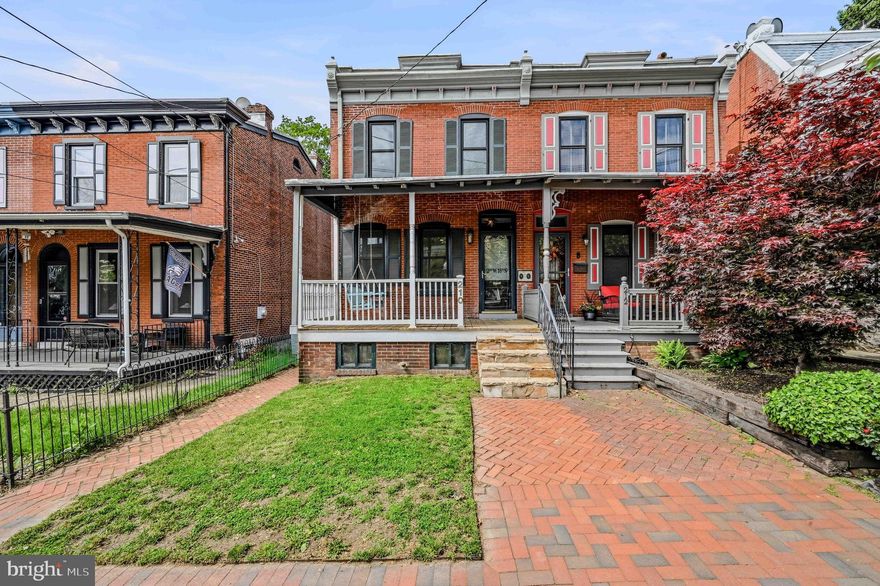 Welcome to this tastefully updated, move in ready 3-bedroom, end of row townhome in Wilmington. This gem is an exquisite blend of classic design and modern comfort. The open floor plan and exposed brick seamlessly connects the rooms making it perfect for entertaining and easy living. Enjoy cooking in the updated kitchen with granite countertops, a plethora of storage space, kitchen cabinet organization systems, gas cooking and stainless steel appliances. The separate main level laundry room also serves as a pantry, providing additional storage. Original hardwood floors enhance the charm of the interiors and create a warm and inviting ambiance throughout the home. The private primary bedroom is a peaceful haven with hardwood floors and features a covered porch where you can relax and unwind. The updated full bathroom strikes a balance of luxury and functionality with a soaking tub and large walk-in shower giving a spa-like experience. Two additional bedrooms complete the second floor. The home also features a finished basement that can be tailored to fit your needs. The home's exterior is equally captivating with a beautifully maintained private fenced yard and a covered front porch adds to the appeal of this home, offering cozy spaces for outdoor relaxation. Situated within walking distance to Brandywine Park, Zoo, Rose Garden, hospital and restaurants. This property is a masterful integration of vintage charm with modern updates.