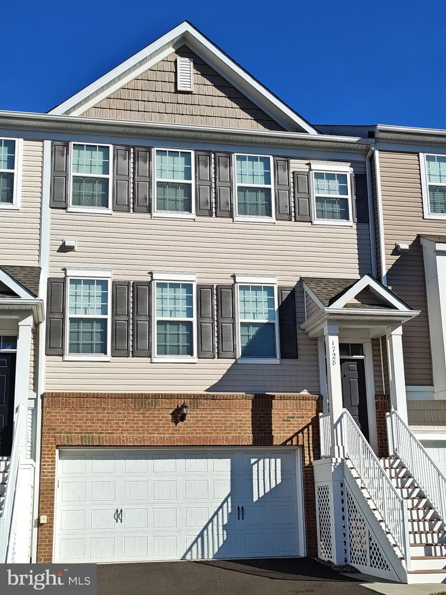 Welcome to 1728 Beacon Lane, a beautifully appointed townhome in the highly desirable Warrington Pointe community, where thoughtful design and modern upgrades come together to create a truly inviting living experience.
The main level features gleaming hardwood flooring and 9-foot ceilings, enhancing the sense of space and light throughout. At the heart of the home, the upgraded kitchen showcases granite countertops, stainless steel appliances, and ample cabinetry, flowing seamlessly into the dining and living areas—ideal for both everyday living and entertaining.
The lower level offers exceptional versatility with a spacious finished area that can serve as a family room, home office, studio, or additional bedroom, along with a convenient half bath and direct access to the rear. A generously sized two-car garage and utility space provide added functionality and storage.
Upstairs, the primary suite offers a comfortable retreat complete with a full bath and walk-in closet. Two additional bedrooms, a full hall bath, and a conveniently located laundry area complete this level. Additional highlights include rear composite deck,  gas heating, cooking, and hot water, along with central air conditioning for year-round comfort.
Perfectly positioned for convenience, this location provides easy access to major roadways including Routes 611, 202, and 309, as well as the Pennsylvania Turnpike, making commuting simple. Nearby shopping and dining options at Warrington Crossing and Shops at Valley Square, along with local parks and recreational amenities, offer a wide variety of options just minutes from your door.