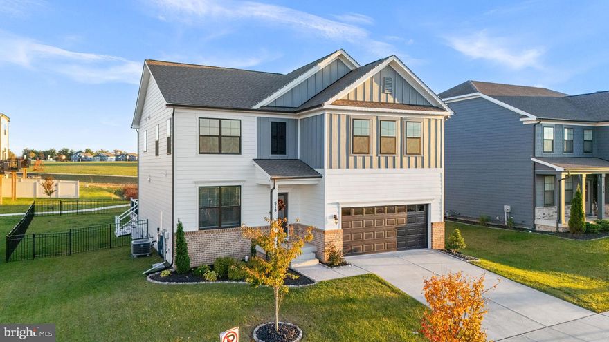 Located in one of Frederick’s most exciting new communities, where modern design meets unbeatable convenience—welcome home to 518 Carroll Walk Avenue!
Built in 2022, this stunning 5-bedroom, 4-full bathroom home offers nearly 2,700 square feet of thoughtfully designed living space, blending comfort, flexibility, and modern style.

Step inside to find soaring 9-foot ceilings, an open-concept layout, and a chef’s kitchen with stainless steel appliances, a large center island, and a built-in dining area perfect for casual gatherings. The main level also features a bedroom or flexible office space, making work-from-home living effortless.

Upstairs, enjoy a spacious family room, generously sized bedrooms with walk-in closets, and a serene primary suite complete with a spa-inspired bathroom with dual vanities, a soaking tub, and a large walk-in closet.

The fully finished walk-out basement adds incredible versatility, offering a bedroom and full bath ideal for guests, a home gym, or an additional hangout space.
Outside, the fenced yard provides privacy and practicality, while the front of the home faces open green space with views of the future Carroll Creek Linear Park and the Catoctin Mountains — with no neighbors directly in front and plenty of parking!

Residents of Renn Quarter enjoy resort-style amenities including a pool, fitness center, clubhouse, playground, dog park, and scenic walking trails. And with Downtown Frederick less than a mile away, restaurants, shops, and year-round events are always within easy reach.

Beautifully maintained and truly move-in ready, this home offers the perfect balance of comfort, community, and convenience in one of Frederick’s most desirable locations. Schedule your showing today!