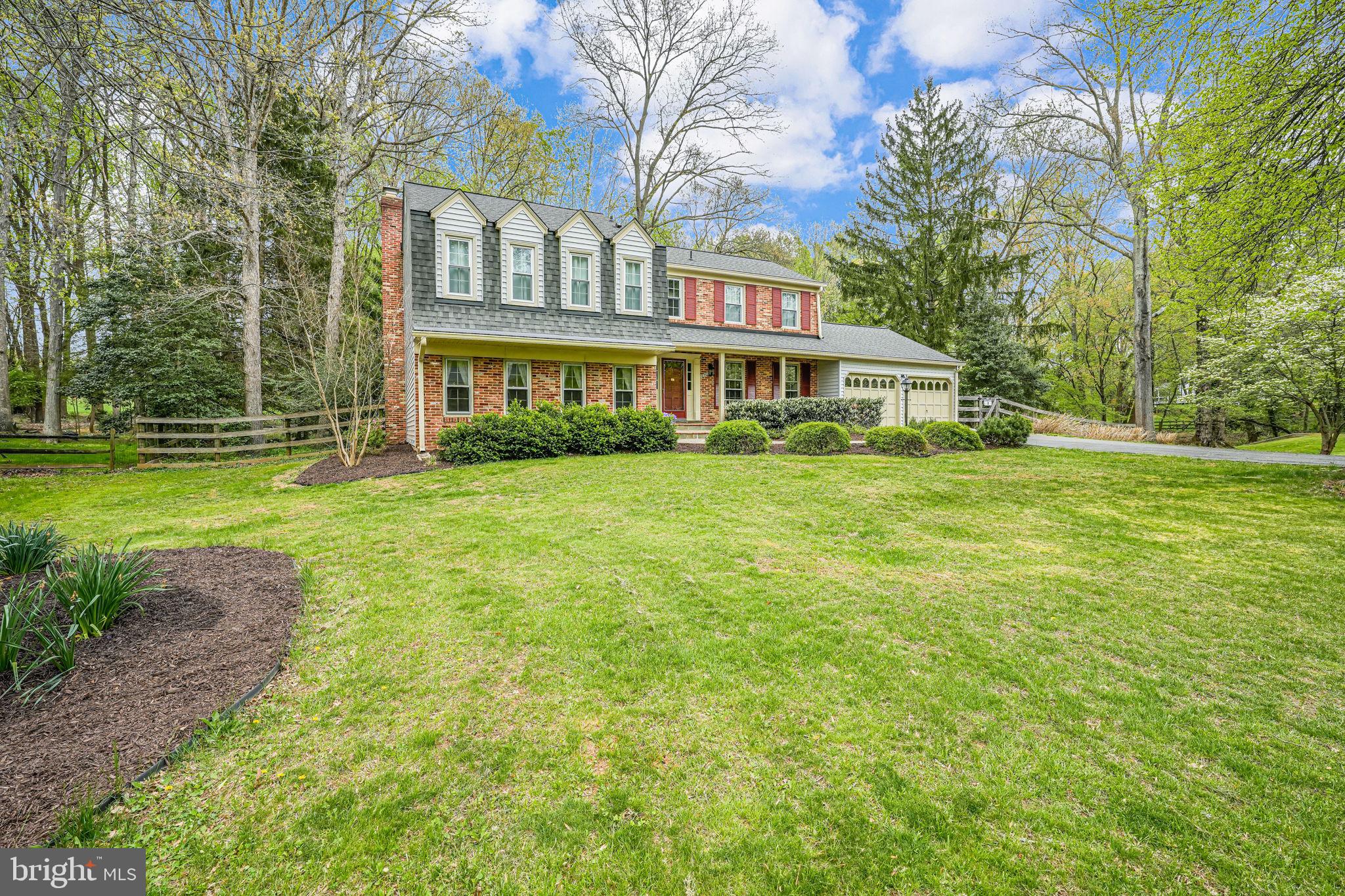 Step into this thoughtfully updated 4-bedroom, 2.5-bath home in Norbeck Estates! Offering 3,722 square feet of finished living space and a spacious two-level addition, this residence blends comfort with functionality. Nestled on one of the largest lots in the neighborhood—1.14 acres total—it provides privacy, space, and room to grow.
The main level welcomes you with expansive living areas, including a formal dining room, a large living room (currently used as an office), and a dramatic two-story family room featuring a classic brick, wood-burning fireplace—perfect for cozy winter evenings. A light-filled sunroom overlooks the serene, tree-lined backyard and is the ideal spot to enjoy your morning coffee after yoga or Pilates.
The galley-style kitchen is a chef’s delight, featuring stainless steel appliances (including a gas range and built-in microwave), granite countertops, a subway tile backsplash, a walk-in pantry, and a convenient breakfast bar.
Also on the main level, you’ll find a generous laundry room with a utility sink and direct access from the oversized garage.
Upstairs, the primary suite offers a walk-in closet and a stylishly updated en-suite bath with a double vanity and beautifully tiled shower behind sliding barn doors. Three additional well-sized bedrooms share a newly remodeled hall bath. One of the secondary bedrooms, part of the addition, includes a wet bar, walk-in closet, and private balcony—ideal for guests, hobbies, or a potential in-law suite.
The finished lower level features a versatile recreation room complete with a wet bar and wine fridge—perfect for movie nights, game days, or home workouts.
Step outside to enjoy the expansive brick and flagstone tiered patio, surrounded by mature trees and parkland—an entertainer’s dream and an inviting space for summer BBQs or fall gatherings.
Enjoy a world of convenience with the vibrant amenities of Olney and Rockville just moments away, including proximity to two Metro stations and local bus service.
Additional highlights:
Heat Pump (2024)
AC unit for Main house (2024)
Water Heater (2020)
Washer & Dryer (2024/2025)
HVAC for Addition (2018)
Roof (2014)
The property includes a combined 1.14 acres—0.40 acres with the home and an adjacent, separately deeded 0.73-acre lot (Tax ID# 1608 0075 4883).