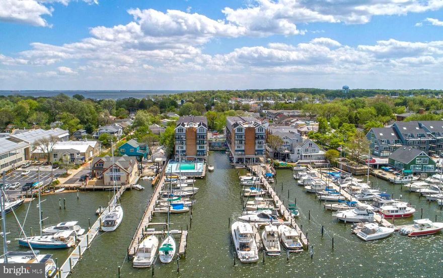 Location! Location! Location! Perched on the top floor of The Tecumseh—Maryland’s first condominium building—this rarely available two-level loft offers water views, thoughtful updates, and an unbeatable Eastport lifestyle and access to all the charm and excitement of coastal living in Annapolis. W401 overlooks Spa Creek with views of Ego Alley, the community marina, and Severn Avenue. This 1-bedroom, 1-bath unit features an open-concept main level with living and dining areas, a well-equipped kitchen, mechanical room, and closet, while the loft-style upper level with exposed beams includes a spacious bedroom with two closets and full bath with soaring ceilings and abundant natural light. Recent improvements include fresh paint, new carpet, and bathroom flooring (2024), a new refrigerator (2022), new HVAC system (2018), and a dishwasher and building-wide roof replacement (2017, assessment paid in full). This unit also includes a boat slip entitlement in the private marina—an exceptional feature for boaters. Community amenities include a gated parking lot, waterfront pool and deck on Spa Creek, private marina, kayak/canoe rack, bike and sail storage, on-site property manager and custodian, pet-friendly policies, secure entry with elevator access, lobby with kitchen and mailroom, and convenient laundry and trash facilities on each upper floor. The Tecumseh Condominium is in THE heart of Eastport, just steps from acclaimed restaurants, local shops, museums, and waterfront attractions, with easy access to downtown Annapolis by foot, bike, or water taxi. Don't miss this opportunity to own in one of Eastport's most sought-after waterfront condominium communities. Welcome to The Tecumseh – Eastport Living at Its Best. 

(The Tecumseh Condominium has a 15-day first right of refusal.)