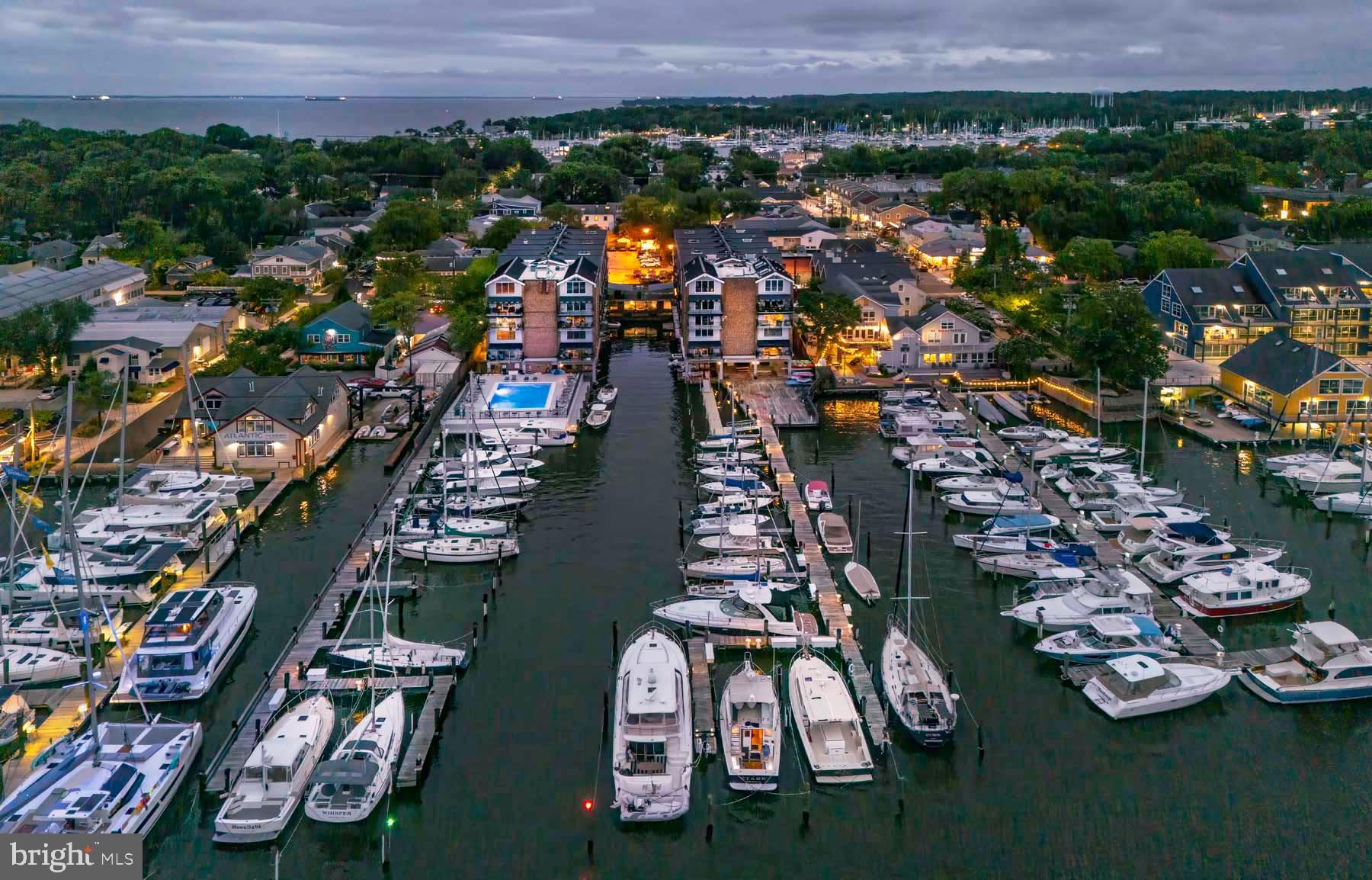 Location! Location! Location! Perched on the top floor of The Tecumseh—Maryland’s first condominium building—this rarely available two-level loft offers water views, thoughtful updates, and an unbeatable Eastport lifestyle and access to all the charm and excitement of coastal living in Annapolis. W401 overlooks Spa Creek with views of Ego Alley, the community marina, and Severn Avenue. This 1-bedroom, 1-bath unit features an open-concept main level with living and dining areas, a well-equipped kitchen, mechanical room, and closet, while the loft-style upper level with exposed beams includes a spacious bedroom with two closets and full bath with soaring ceilings and abundant natural light. Recent improvements include fresh paint, new carpet, and bathroom flooring (2024), a new refrigerator (2022), new HVAC system (2018), and a dishwasher and building-wide roof replacement (2017, assessment paid in full). This unit also includes a 19’ boat slip entitlement in the private marina—an exceptional feature for boaters. Community amenities include a gated parking lot, waterfront pool and deck on Spa Creek, private marina, kayak/canoe rack, bike and sail storage, on-site property manager and custodian, pet-friendly policies, secure entry with elevator access, lobby with kitchen and mailroom, and convenient laundry and trash facilities on each upper floor. The Tecumseh Condominium is in THE heart of Eastport, just steps from acclaimed restaurants, local shops, museums, and waterfront attractions, with easy access to downtown Annapolis by foot, bike, or water taxi. Don't miss this opportunity to own in one of Eastport's most sought-after waterfront condominium communities. Welcome to The Tecumseh – Eastport Living at Its Best.
(The Tecumseh Condominium has a 15-day first right of refusal.)