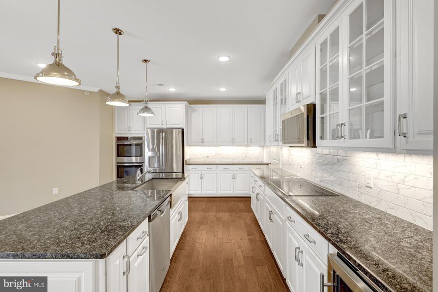 NEW PRICE!!! BEST PRICE PER SQ. FT. ..... HURRY, SELLING BELOW COMPARABLE SALES.  OPEN SUNDAY FROM 1-3PM. .
Luxury 55+ Living in Birchwood at Brambleton — Top-Floor Condo with Den, Garage Parking & Storage

Welcome to resort-style living in the highly sought-after Birchwood at Brambleton, a premier 55+ active adult community in Ashburn. This stunning top-floor condo offers the perfect blend of comfort, elegance, and low-maintenance living.

Inside, you’ll find a bright, open layout featuring 2 spacious bedrooms PLUS a versatile den, ideal for a home office, hobby room, or guest space. The oversized gourmet kitchen is truly the heart of the home — perfect for entertaining and everyday living with abundant cabinetry, counter space, and room to gather.

Both bedrooms feature large custom-designed closets offering exceptional storage, complemented by garage parking and an additional storage unit. Enjoy peaceful mornings or evening relaxation on your private balcony, and the convenience of elevator access in a beautifully maintained building. This home has been meticulously cared for and is in pristine, move-in ready condition.

Residents of Birchwood enjoy world-class amenities including:
• Indoor & outdoor pools
• Pickleball & bocce courts
• Clubhouse with social activities
• Art studio & golf simulator
• Scenic lake, walking paths & trails
• A vibrant calendar of community events

All of this just minutes from everyday conveniences like Walmart, Target, dining, healthcare, and major commuter routes.

This home offers the perfect opportunity to enjoy comfort, convenience, and an active 55+ lifestyle in one of Loudoun County’s most desirable communities.

Seller is motivated and ready for a quick closing. Don’t miss this exceptional opportunity