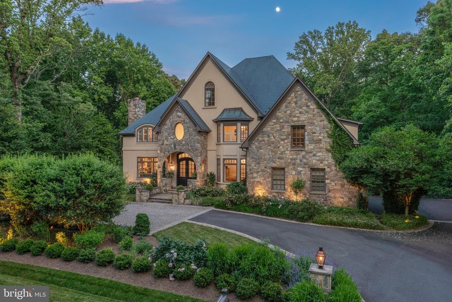 Discover the epitome of luxury living in this spectacular home, offering over 8,000 square feet of livable space nestled on a serene wooded lot. This architectural masterpiece features gorgeous stone and stucco exteriors with dramatic rooflines and a Copper roof. A circular driveway with gas lanterns welcomes you to this stately residence.
Step inside the breathtaking two-story foyer through custom steel doors. The main level boasts new oak hardwood floors and high ceilings, while the upper two levels showcase an array of vaulted ceilings, adding to the home's grandeur. This unique floor plan includes four fully finished levels, providing space and privacy for all family members and guests. The back staircase leads from the mudroom side entrance to a spacious in-law or guest suite, perfect for extended family or visitors.
The home features 7 bedrooms and 6.5 bathrooms. The second level includes 4 bedrooms and a laundry room with 2 sets of machines for all your laundry needs. The renovated primary bath is luxurious with radiant heated floors, while a guest room with a modernized en-suite bath and two additional bedrooms share an updated hall bath. The third level features two more large bedrooms, an upgraded bath, and a gathering space filled with light from skylights.
The recently renovated kitchen is a chef's dream, equipped with top-of-the-line appliances including a 6-burner Wolf range with pot filler, Sub-Zero refrigerator and freezer, warming drawer, convection oven, marble counters and a farmhouse sink. The sophisticated butler's pantry with marble counters, beautiful cabinetry including glass built-ins, dishwasher and wine refrigerator off the large formal dining room adds a touch of elegance and convenience. Entertain in the formal living room in elegance and warmth by the fireplace. A large office with built-ins overlooks the backyard. The family room with a gas fireplace, the heart of the home, is open to the kitchen.
Outdoor living is extended off the kitchen by custom Dutch Door design double doors that open to a large screened-in porch with skylights and ceiling fans overlooking the sprawling lawn and beautifully landscaped grounds, surrounded by woods. The stone patio with a built-in grill, fire pit, and an expansive lawn creates an idyllic setting for hosting grand events and countless guests. The covered outdoor kitchen further enhances the outdoor living experience, perfect for entertaining year-round.
The walk-out lower level features several recreation areas, a bar with a built-in Sub-Zero refrigerator, kegerator, and custom counters. It also boasts full surround sound and reclaimed heart of pine wide plank wood floors, adding to the home's charm and functionality. Additionally, there is a gym, a bedroom, and a full bath.
Overall, 4 fireplaces – 2 gas and 2 wood-burning – provide warmth and ambiance throughout the seasons. The large mudroom with cubbies off the garage adds functionality, while the 3-car garage and motor court offer ample parking and storage. Additional custom features abound, including a whole house generator and a 3-zone HVAC system for peace of mind and comfort.
Situated on the best lot in Hannah Hills, this exceptional residence epitomizes luxury living at its finest. Whether hosting grand soirées or enjoying quiet moments of reprieve, this Oakton Estate offers a lifestyle of unparalleled sophistication and comfort. Don't miss the opportunity to own this extraordinary property.