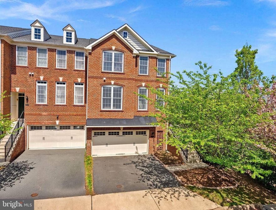 Gorgeous 3-level Brick END UNIT updated townhome with two-car garage, extra storage and just steps to old town Purcellville, dining, shopping and more.  
From the minute you walk in to the sunny foyer, you will love all the updates and features. The sun-filled family room has custom built-ins and flexible space that you can arrange as you wish! Living room-Dining room combo is open and great for entertaining.

Updated kitchen with bay window and eat-in area is bright and fresh. Between the very cool built-in bar,  center island and accents, you'll enjoy every minute spent in the kitchen. Take a step out onto the large deck set higher with gorgeous views. There are steps down to fenced-in back yard with gorgeous blossoming trees.

Upstairs, the primary bedroom has walk-in closets, soaring ceilings and beautiful ensuite bathroom. Laundry is located on upper level and secoondary BRs are bright and have vaulted celings.

Basement? What basement? This walkout basement has a french door and full size window, making you  feel like your on the main floor of the home with all the light.  There is a full bath, storage and plenty of room for an office, play area or entertainment central.

Don't miss this beauty!! Located close to the W&OD Trail, Franklin Park and downtown Purcellville.

** PLEASE NOTE all wall decorations in Primary BR and Pink BR are wall decals and can easily be removed with no damage and little effort. **