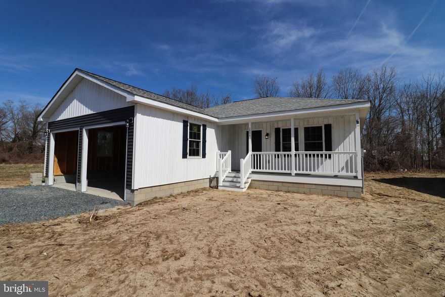 Discover your perfect retreat in this beautifully crafted brand new 3-bedroom, 2-bath home, ideally located just 20 minutes from Salisbury and 40 minutes from Ocean City.  This home features a spacious two-door garage and a lovely back deck, perfect for outdoor relaxation and entertaining. Inside, enjoy a modern kitchen with stainless steel appliances and elegant granite countertops. The comfortable open layout includes plush carpet in the bedrooms and stylish LVP flooring throughout the main living areas. Ceiling fans in the bedrooms and living room provide year-round comfort, while the efficient 15 SEER heat pump system ensures energy savings. Enjoy the peace of mind that comes with a home equipped with all the essentials, eliminating the need for big-ticket purchases. Property originally appraised for $280,000 and is being sold at an introductory price. This area is prepped for future development, so do not miss out on this opportunity to be a part of this up and coming community! *** Seller will install a ring doorbell with the sale of the property.