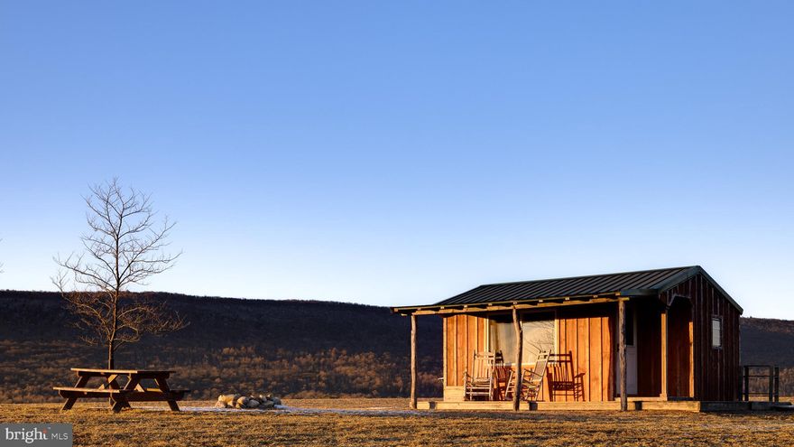 Exceptional opportunity to acquire a turnkey farm/retreat situated on  50+ acres nestled between the Appalachian Trail and Hawk Mountain. Charming 18th century farmhouse encompassed by wooded and tillable land, two ponds, a creek, hiking trails, multiple gardens, pastures, and stunning panoramic mountain views. The property also features a barn ideal for hosting events, seven cottages, yoga studio, gym, and sauna; all thoughtfully renovated and designed by the current owner. Income producing property that has previously hosted weddings, retreats, AirBnB guests, and other private events. Fantastic birdwatching in a serene setting. Ideally situated with two parallel road access points. Potential to design and build your dream residence perched above the farm with spectacular sunrises and sunsets over the mountaintops. Professionally managed (property manager can remain, at buyer's option). Only an hour and a half drive to Philadelphia, two hours to New York City, and 35 minutes to Lehigh Valley International Airport. Clean and Green property for preferential taxes.