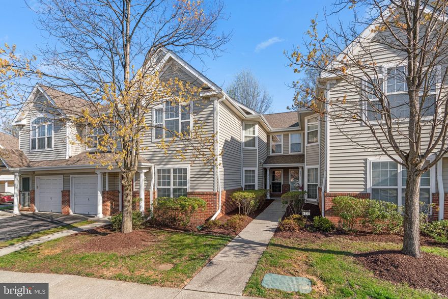 OFFER DEADLINE TUESDAY 4/29 5:00 PM. Beautifully maintained condominium residence offering 1,260 square feet, 2 bedrooms, and 2 full baths, ideally located in the charming Village of Long Reach. A traditional foyer opens into a warm and inviting den or office, living room with hardwood floors and a cozy gas fireplace, seamlessly connected to the dining area with direct access to a private back patio—perfect for morning coffee or winding down in the evening. Just off the foyer, a dedicated den provides flexible space for working from home or quiet reading. The kitchen blends function and style with upgraded countertops, stainless steel appliances, double ovens, a pantry, and ample cabinet storage. A nearby laundry room and a full bath enhance daily convenience. Two carpeted bedrooms include a spacious main-level primary suite with two closets and a private en suite bath. The second bedroom features crown molding and offers privacy for guests or extended stays. Additional highlights one assigned parking space.