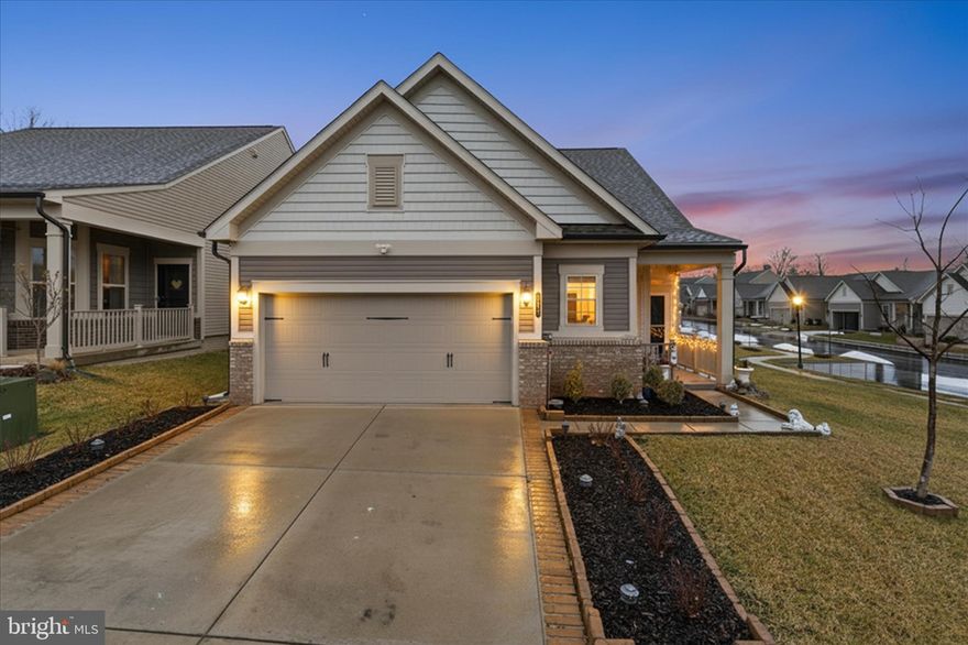 Don't miss this beautifully upgraded home in Haymarket’s sought-after 55+ community, Carter's Mill. This 4-bedroom, 3-bathroom residence is thoughtfully designed for comfort, style, and low-maintenance living, offering a premium corner lot with additional open green space and parking!  Step inside to find an inviting open floor plan with luxury finishes and premium upgrades throughout. The gourmet kitchen features granite counters, custom white cabinets, an upgraded tile backsplash, a designer range hood, and a spacious sun room—the perfect spot to start your day with a cup of coffee. The owner’s suite boasts a spa-like en suite bath with premium tile and shower fixtures, while an additional upgraded bathroom adds a touch of luxury for guests. The second bedroom is adjacent to the second premium full bath and the 3rd bedroom could be used as a sunlit home office!  The loft area is fully finished with generous sized climate controlled storage, a 4th private bedroom, and full bath.  Additional highlights include custom blinds, mudroom, lighting fixtures, an open staircase, a covered front porch and large patio built for entertaining!  Beyond your beautiful home, enjoy resort-style amenities in this vibrant 55+ community. The clubhouse offers both indoor and outdoor pools, a spa, a fitness center, and multiple social spaces, along with craft, game, and meeting rooms. Outside, take advantage of the community garden, scenic trails, and pickleball and bocce courts—perfect for an active and social lifestyle! Enjoy a peaceful, low-maintenance lifestyle with easy access to shopping, dining, entertainment, wineries and breweries, multiple golf courses and major commuter routes such as I66 and Rt 29!