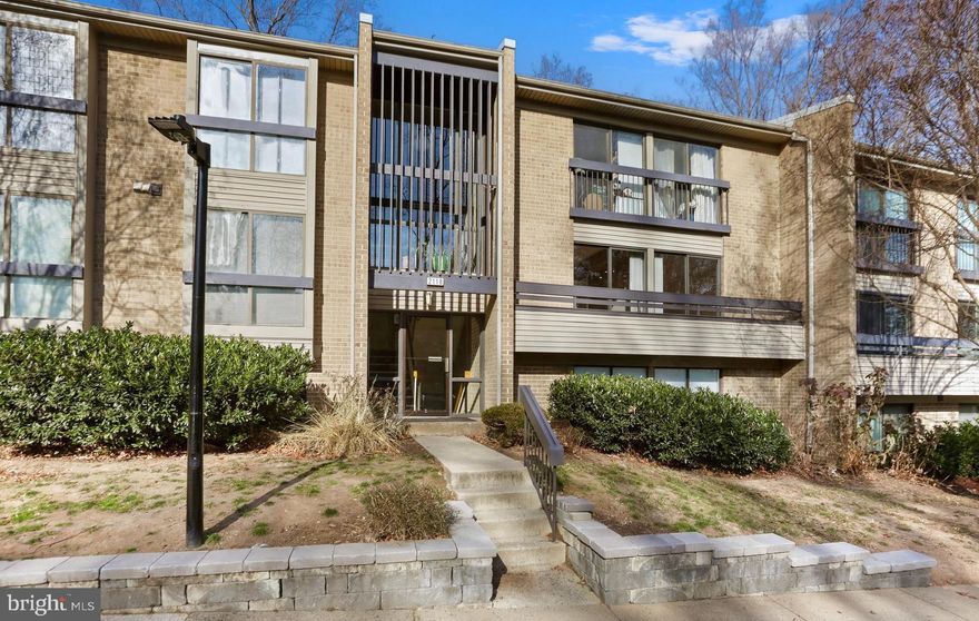 Welcome to 2118 Green Watch Way #10/201C, a spacious two-bedroom, two-bath condominium quietly tucked within the established Woodwinds community of Reston. Offering approximately 1,170 square feet of living space, this beautiful home enjoys a serene, tree-framed setting with uninterrupted views over the rolling fairways of the Reston National Golf Course. Designed with a split-level layout that feels open yet inviting, every detail draws you toward the natural beauty that surrounds it.

From the foyer, the home opens gracefully to the sunken main living area below, where sunlight spills through a wall of windows and dances across warm wood floors. The open layout is both relaxing and refined, creating a sense of space that feels connected to the outdoors. Sliding glass doors lead to a private balcony with peaceful views of the golf course framed by mature trees—an inviting retreat perfect for morning coffee, quiet evenings, or watching the sunset fade across the horizon. The adjoining dining area flows easily into the kitchen, which offers ceramic tile flooring, ample cabinetry, generous counter space, a built-in pantry, and updated appliances. The range, dishwasher, and refrigerator were all replaced in November and December of 2025, adding modern efficiency while maintaining the kitchen’s clean, timeless design.

The bedroom wing feels restful and secluded, a quiet escape at the end of the day. The primary suite features wood floors, dual closets, and sliding glass doors that open to a second private balcony shared by both bedrooms—ideal for enjoying a soft morning breeze or an evening under the stars. The ensuite bath offers a clean, classic look with a walk-in shower and extended vanity, while the second bedroom—bright and versatile—serves beautifully as a guest room, home office, creative space, or comfortable second bedroom. A clothes washer and dryer, also replaced in November and December of 2025, are thoughtfully tucked into the home, adding everyday convenience.

Residents of Woodwinds enjoy a tranquil, wooded setting with full access to Reston Association amenities, including multiple pools, tennis courts, playgrounds, and more than 55 miles of walking and biking trails that wind around lakes, parks, and golf greens. Conveniently located near the Wiehle–Reston East Metro Station, South Lakes Village Center, and Reston Town Center, this home also offers quick access to the Dulles Toll Road, Fairfax County Parkway, and Washington Dulles International Airport.

With its light, warmth, dual balconies, recent appliance updates, and breathtaking golf course views, this home captures the essence of relaxed Reston living—peaceful, effortless, and beautifully connected to nature.