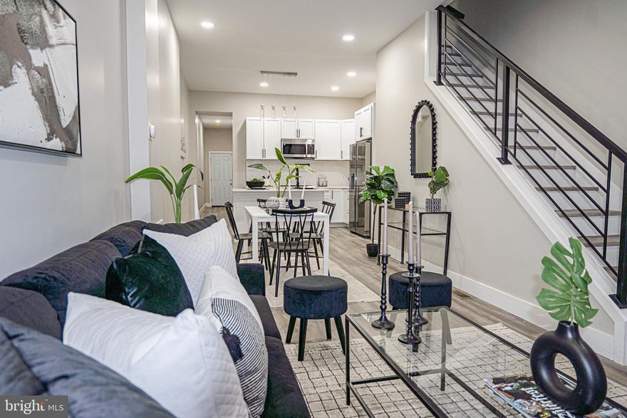 Welcome to a truly exceptional, fully renovated Colonial townhouse in the heart of Coppin Heights, proudly delivered by ROI Investments LLC—a builder known for setting the standard in Baltimore City for over a decade.

This is not a typical renovation. This is a custom-crafted home, the kind only 15–25 buyers per year ever get the opportunity to own. And this one is reserved for 2026.

From the moment you enter, the quality speaks for itself: custom hardwood floors, a statement staircase, recessed lighting, and a thoughtfully designed open-concept layout showcasing meticulous workmanship. Every detail is backed by the builder’s proven systems and processes—engineered for efficiency, comfort, and long-term enjoyment.

The main level flows seamlessly from the living area into a spacious eat-in kitchen and dining space, perfect for entertaining. A large main-level bedroom with a half bath adds flexibility, while the rear door opens to your private paved parking pad—a rare city convenience.

Upstairs, you’ll find:

A luxurious primary owner’s suite with a stunning full bath

A generous bonus room ideal for an office, nursery, or lounge

A second primary suite at the rear with its own full bath

The lower level offers a clean, sealed, and secure basement, perfect for storage or ready to be finished to suit your needs.

This home isn’t just renovated it’s curated. A rare opportunity to own a standout property built for buyers who recognize craftsmanship, intention, and long-term value.

A custom gem. A limited opportunity. A home to enjoy for life.