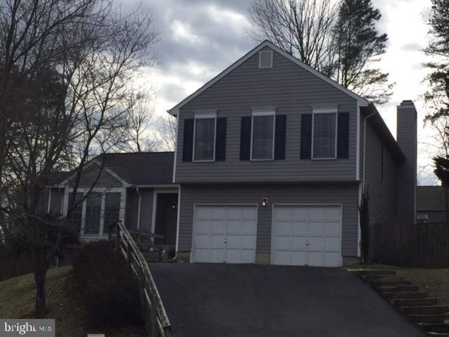 This 4-level home offers SO much space! Vaulted ceiling in living room, separate dining room and eat-in kitchen. Then step down to the family room with wood-burning fireplace and sliding doors to the fenced backyard. The large two-level deck is a great place to entertain! HUGE master suite with two walk-in closets! Two car garage with openers and a HUGE unfinished lower level (4th level) provides room to store all your boxes and gear - or makes a great hang out space. Two year lease is available but owners will accept one year as well. Pets are case-by-case with $500 refundable pet deposit. Enjoy North Stafford living so close to Quantico, commuter lots, VRE and more!