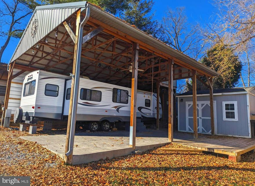 This is a gated community so you need to enter at the guard shack. Entry is not permitted without ID per the office rules. Bring ID's to the office or guard shack for visitor pass. THIS IS A SEASONAL CAMPGROUND! OPEN FROM APRIL 1 TO NOVEMBER 1.
** WELCOME TO RIVER BEND/SEASONAL LOT AVAILABLE TURN KEY** River Bend is a privately owned 400 acre recreational- vehicle camp resort with seasonal activities for members, families and guests. This great RV park is tucked away on the Upper Potomac River of West Virginia, River Bend is one of West Virginia's most popular family seasonal destinations. . Just a short drive from the Washington and Baltimore metro area. Open with utilities from April 1 to November 1. Lot owners have access to their property the entire year. *** Members Enjoy *** * Amazing views and wildlife, Potomac River access, Trails, Swimming pools, Mini-Golf, Youth center, Tennis and basketball courts, laundry facilities, convenience store, deli and lounge. *Bath houses through out the park, boat ramp, bar and grill and even a church located on the grounds. River Bend also hosts numerous activities such as 4th of July fire works, small carnival, bonfires, poker runs, horse shoe tournaments, car show, Halloween Trick or Treat and so much more. 
***Property Details ***  Great Lot with pavilion, storage shed that acts as more sleeping quarters, beautiful stamped concrete pad.  Camper is a 2014 Prime Time Avenger 33RSD Forest River Travel Trailer.  Close to the pool, camp store, playground.  
Come and check out this amazing lot  **** Lets bring an offer to to table! ***BRING YOUR BEST OFFER*** YOU WON'T WANT TO MISS THIS ONE.***