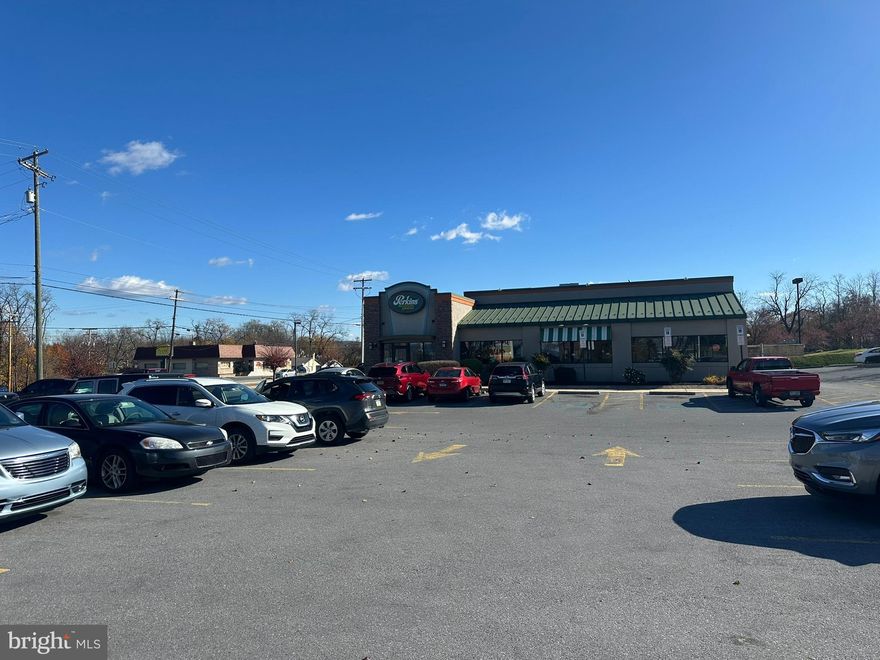 Discover an exceptional opportunity with this highly visible commercial property, ideally located on a corner lot in the busy Franklin Center Shopping Plaza — home to major retailers like Ollie’s, TJ Maxx, and more. Positioned directly across from Sheetz and just 0.3 miles from I-81, this property offers outstanding accessibility and visibility for any business. Sitting on 0.84 acres, the site provides ample parking for customers and staff, and its strategic location ensures consistent traffic from surrounding shopping, dining, and hotels. The building’s layout offers flexibility for a variety of uses — retail, restaurant, office, or service-based operations. It is currently equipped with a commercial kitchen, making it especially well-suited for food service or catering businesses. The property features a well-maintained exterior, easy ingress and egress, and strong neighboring businesses that draw steady customer flow. Whether you’re expanding your business or launching a new venture, this space offers the functionality, exposure, and location advantage you need to succeed. Don’t miss the chance to invest in a property that delivers both visibility and growth potential in one of Chambersburg’s most desirable commercial corridors.