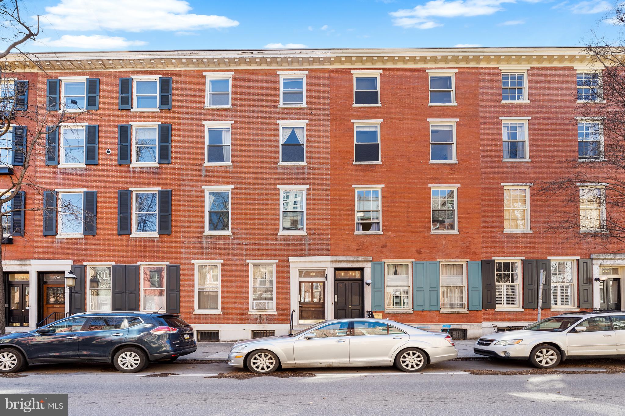 Prime Rittenhouse Real Estate in an A+ location! Pine Street 7-unit multi-family investment property with TWO CAR PARKING on a 20' wide x 90' deep lot. The building is comprised of 5 one-bedroom apartments and 2 two-bedroom apartments. All with updated kitchens, all currently leased. Each apartment has a storage unit in the basement.