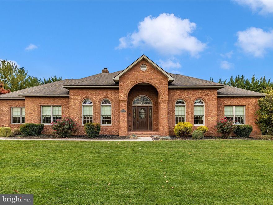 Incredible property at an incredible price! Nearly new solid brick custom designed rambler with three car side loading garage within walking distance to Fountain Head Country Club! Open and spacious with 9’ , vaulted and trey ceilings, this property checks all the boxes to be the winner! Gourmet kitchen with triple ogee edge and solid cherry cabinets, glistening hardwoods, upgraded ceramics, crown molding and chair rail set this property a cut above the rest!Large primary bedroom with walk in closet and large full bath with jacuzzi tub and stand up shower. Full unfinished walk out lower level could be easily finished to add lots more square footage. Heated with desirable natural gas, make this your forever home!