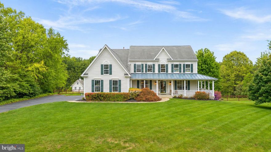 Original owners and beautifully maintained, this home has been thoughtfully cared for and updated over the years. From the moment you arrive, the oversized wraparound front porch sets the tone, welcoming, relaxed, and ready to impress.

Set on 3.64 acres, including over an acre of wooded land and backing to Agricultural Preserve farmland, this property offers a rare sense of space, privacy, and scenic beauty.

Step inside to a stunning two-story foyer with hardwood floors, flanked by formal living and dining rooms. The main level opens up to an easy, inviting layout where the family room, kitchen, and sun-filled, window-lined breakfast room all connect seamlessly, perfect for everyday living and entertaining.

The gourmet kitchen features granite countertops, stainless steel appliances, a gas oven, and both under and over-cabinet lighting. A center island with a breakfast bar keeps everyone connected. The family room is warm and inviting with a cozy wood-burning stove, raised hearth, and mantel.

Tucked quietly at the back of the home, the private office offers peaceful backyard views through large windows. You’ll also find a powder room, a spacious laundry/mud room, and an oversized three-car garage with epoxy floors.

The walkout lower level adds even more flexibility with a large rec room, a bonus flex space with doors, ideal for a gym, game room, or second office, plus a true fifth bedroom with three egress windows. There’s also a large workshop with an egress window already in place, ready to be finished as an additional bedroom or kitchenette if needed. A second laundry area with sink and abundant cabinetry, plus a convenient laundry chute, adds everyday ease.

Upstairs, a double hardwood staircase with classic wainscoting and iron balusters, along with a rear staircase off the kitchen, offers both style and function. The primary suite is a retreat of its own, featuring cathedral ceilings, a walk-in closet with built-ins, and a sitting area with custom cabinetry overlooking the quiet backyard.

The fully updated primary bath feels like a spa, with a frameless glass walk-in shower, dual shower heads, custom niches, pebble stone floor, double vanities, a freestanding clawfoot tub, a built-in vanity area, and a private water closet.

Two bedrooms share a Jack and Jill bath, while a fourth bedroom enjoys its own ensuite.

And then there’s the backyard…

A space designed to be enjoyed. The charming backyard cottage can be whatever you need: a garage, workshop, office, playhouse, or creative retreat, complete with a loft and pulley-access attic. Out front, a garden space adds to the charm, while the rest of the yard invites you to unwind or explore with a firepit gathering area, playset, and private wooded trails.

If you're looking for a bit of privacy without feeling isolated, Branch Hill Estates offers the perfect balance, an impressive neighborhood surrounded by the beauty of the Ag Reserve.

For added peace of mind, the sellers have been proactive with recent testing and maintenance. The well water was tested in March 2026, the septic system was inspected and pumped on April 1, 2026, and the HVAC system and humidifier were inspected on April 16, 2026, with receipts available.

Impressive updates include a new kitchen refrigerator (2026), washing machine (2024), dishwasher (2019), exterior painting (2025), gas furnace and basement HVAC (2011), attic HVAC system (2016), water heater (2017), water pressure tank (2023), and well pump (2020).

This is the kind of home that feels special the moment you step onto the porch and only gets better as you walk through it.