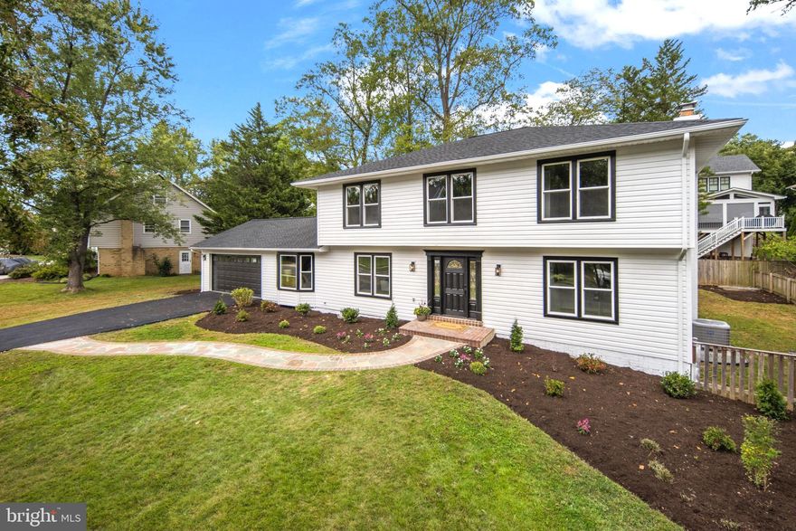 Nestled in the heart of Falls Church, VA, this beautifully renovated three-level home captures the essence of contemporary living at its finest. Meticulously remodeled and redesigned to meet the desires of the modern homeowner, this home's open floor plan seamlessly merges sophistication and functionality.
As you step inside, you'll be greeted by the warm allure of hardwood floors that span both the main and upper levels. The open floor plan seamlessly connects the living room, dining area, family room and the brand-new gourmet kitchen, creating an ideal space for entertaining and daily living.
The gourmet kitchen is a culinary enthusiast's delight, boasting stainless steel appliances, quartz countertops, and a generously-sized waterfall island. Crisp white cabinets provide ample storage and lend an air of sophistication to this culinary haven.
On this level, you will also find a private office that provides the perfect environment for productivity.
Venture upstairs to discover four generously-sized bedrooms and two full baths. The primary bedroom is a true retreat, featuring an en-suite bathroom with a large luxurious walk-in shower, a tub, and a double vanity. The spacious walk-in closet ensures your wardrobe has a place to call home.
Down the stairs, the basement level opens up to a sprawling entertainment area, complete with a sleek modern fireplace and a wet bar – the perfect setting for gatherings and relaxation. An additional bedroom and full bath on this level offer flexibility and convenience.
UPDATES (all renovations were completed in September 2023): New Windows, New Roof, New Appliances, New Cabinets, New Doors, New Trex Deck, Fully remodeled kitchen, Fully remodeled baths, New Paint throughout and more.  
LOCATION: McLean High School. Distance to West Falls Church Metro Station is aprx. 2 miles, Tysons Shopping Center is aprx. 4.4 miles, City of Falls Church Downtown is aprx. 3 miles.