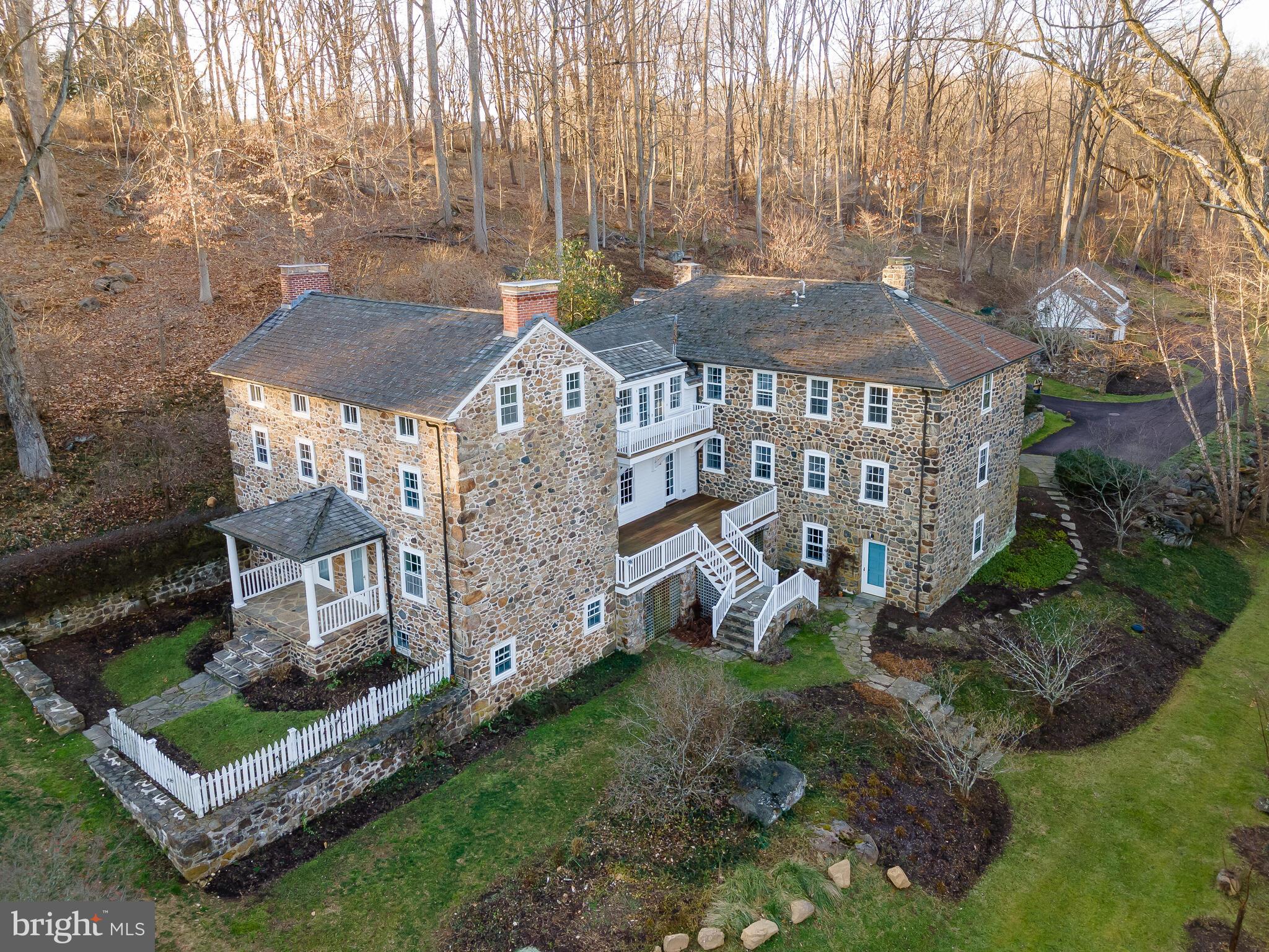 One of the original properties of the Radnor Hunt, this iconic, all-stone Chester County farmhouse will delight any buyer seeking ultimate privacy, custom finishes and appointments characteristic of early architecture, and deep appreciation for nature. Long private driveway leads to magical grounds, featuring matured, professional landscaping, designed by well-regarded Jonathan Alderson. The house, originally two structures, was conjoined under the careful direction of Peter Zimmerman and now offers a truly one-of-a-kind residence. The end result is an enchanting, whimsical and casually elegant home which seamlessly blends period styling with amenities today’s buyers seek. Enjoy many outdoor living spaces offering peaceful tranquility and deep connection with mother nature only further highlighted by the melodies of the babbling Crum Creek. Millstone water feature, and incredible front porch greets homeowners and guests alike. Armond in-ground pool fenced with pergola area. The cheery interior is equally remarkable, offering four levels of living spaces, lending itself to a versatile and flexible floor plan like no other. Offering a true sense of community, enjoy living on one of Radnor Hunt’s most cherished roads, yet so private. Highly acclaimed Great Valley School District. Close proximity to shopping and dining destinations along Philadelphia’s Main Line. Easy commuting to Center City (SEPTA R-5 Line), NYC, D.C. and points beyond (Amtrak Service), PHL Int’l Airport and major roadways. A hard-to-find lifestyle awaits the next lucky homeowner. Turnkey condition with quick possession! Must be seen to be truly appreciated.