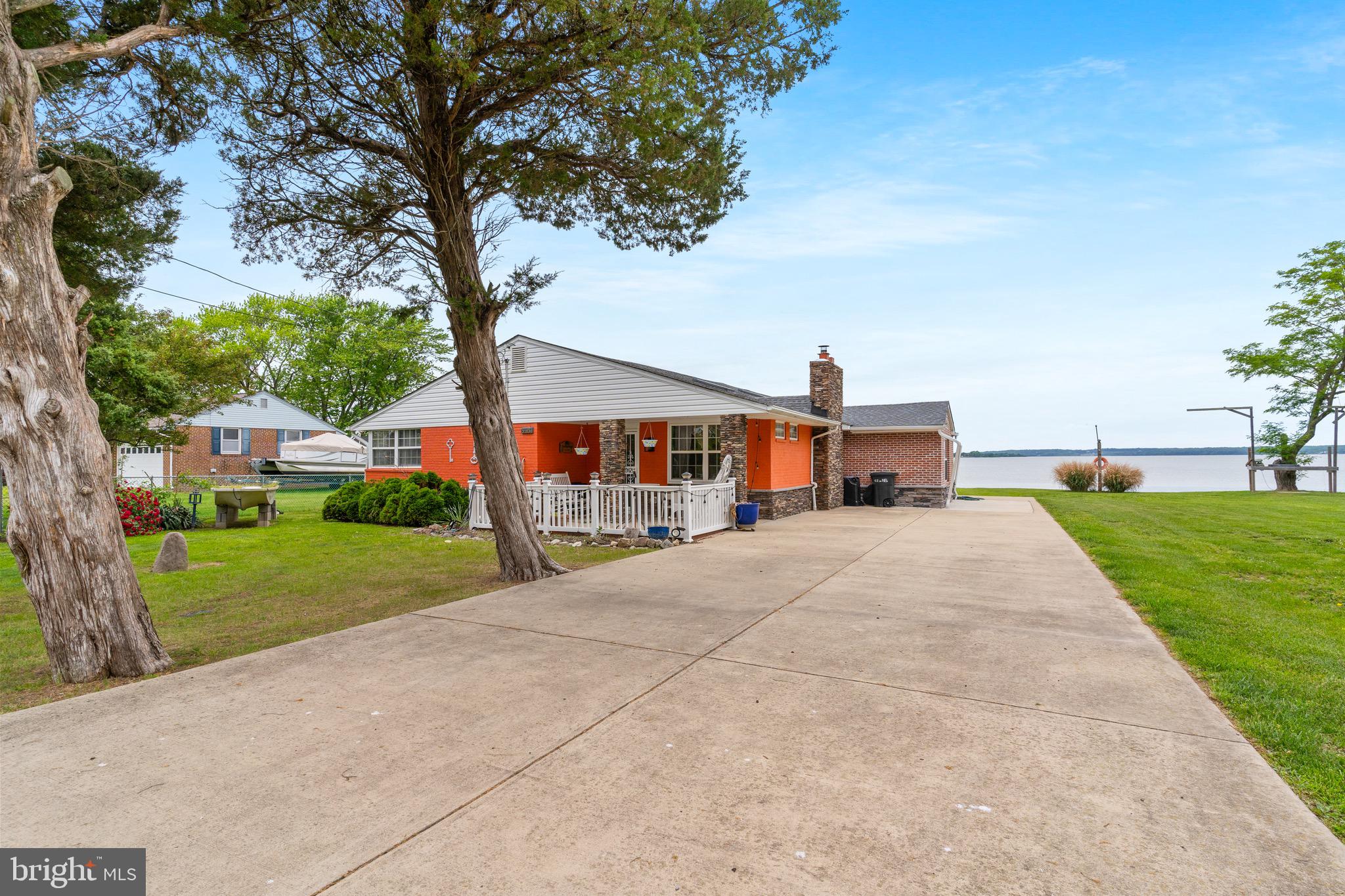 Waterfront Elegance on the Wicomico River| 3 bed, 2 bath | recently renovated, .045 Acres Direct, Wicomico River Access, Discover the perfect blend of modern luxury and serene riverfront living, Nestled on a peaceful half-acre lot with breathtaking views of the Wicomico River, this meticulously renovated 3 bedroom, 2-bathroom home offers a rare opportunity to own a slice of paradise just moments from the Chesapeake Bay. Ideal for boaters, nature lovers, or anyone seeking tranquility, this property promises lifestyle of relaxation and connection to the water. Key features: Stunning Water Views:*Wake up to ever-changing vistas of the tidal Wicomico River, part of the Potomac River estuary system. Perfect for kayaking, fishing, or watching eagles soar. Recent High-End Renovation: *Completely updated with designer finishes, including **gleaming hardwood floors**, **luxurious granite countertops**, and premium fixture. Enjoy morning coffee or evening sunsets in the bright sunroom, or host gatherings on the spacious covered deck overlooking the water. Cozy Ambiance: Unwind by the **wood-burning fireplace** in the living room., surrounded by natural light and open-concept living spaces. An amazing property that you wouldn't want to miss.