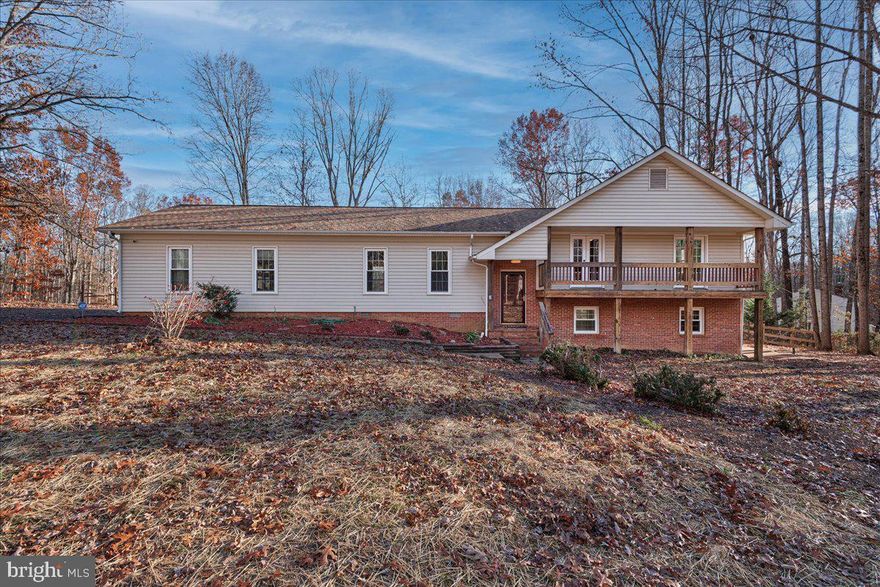 WOW!  4BR/3BA BI-LEVEL home on 4 ACRES with A1 ZONING! Custom MULTI-LEVEL COMPOSITE DECK and PAVILION to enjoy the picturesque scenery! WOOD FLOORING in KITCHEN, DINING and LIVING ROOM plus TILE FLOORING in all BATHROOMS and lower level FAMILY ROOM. The main level features a SPACIOUS LIVING ROOM appointed with CROWN MOLDING, separate DINING ROOM, KITCHEN featuring NEWLY REFINISHED CABINETS, NEW COUNTERTOPS complete with exit onto REAR DECK. The main level also features 2 BEDROOMS with access to a VERANDA plus a MASTER BEDROOM with EN SUITE BATH & an additional HALL BATHROOM. Lower level BOASTS a LARGE FAMILY ROOM appointed with TILE FLOORING, WAINSCOTING, WOOD BURNING STOVE & WALK-OUT EXIT onto  CONCRETE PATIO. The lower level is complete with a FULL BATHROOM, 4TH BEDROOM & LAUNDRY ROOM. This PRIVATE setting offers 4 outdoor entertaining areas and welcomes you with a long, ASPHALT DRIVEWAY, oversized 2 CAR, SIDE-LOAD GARAGE plus an additional CONCRETE parking pad. NO HOA! It is a true horse property, 2 stalls and 2 pastures have been treated and fenced in.