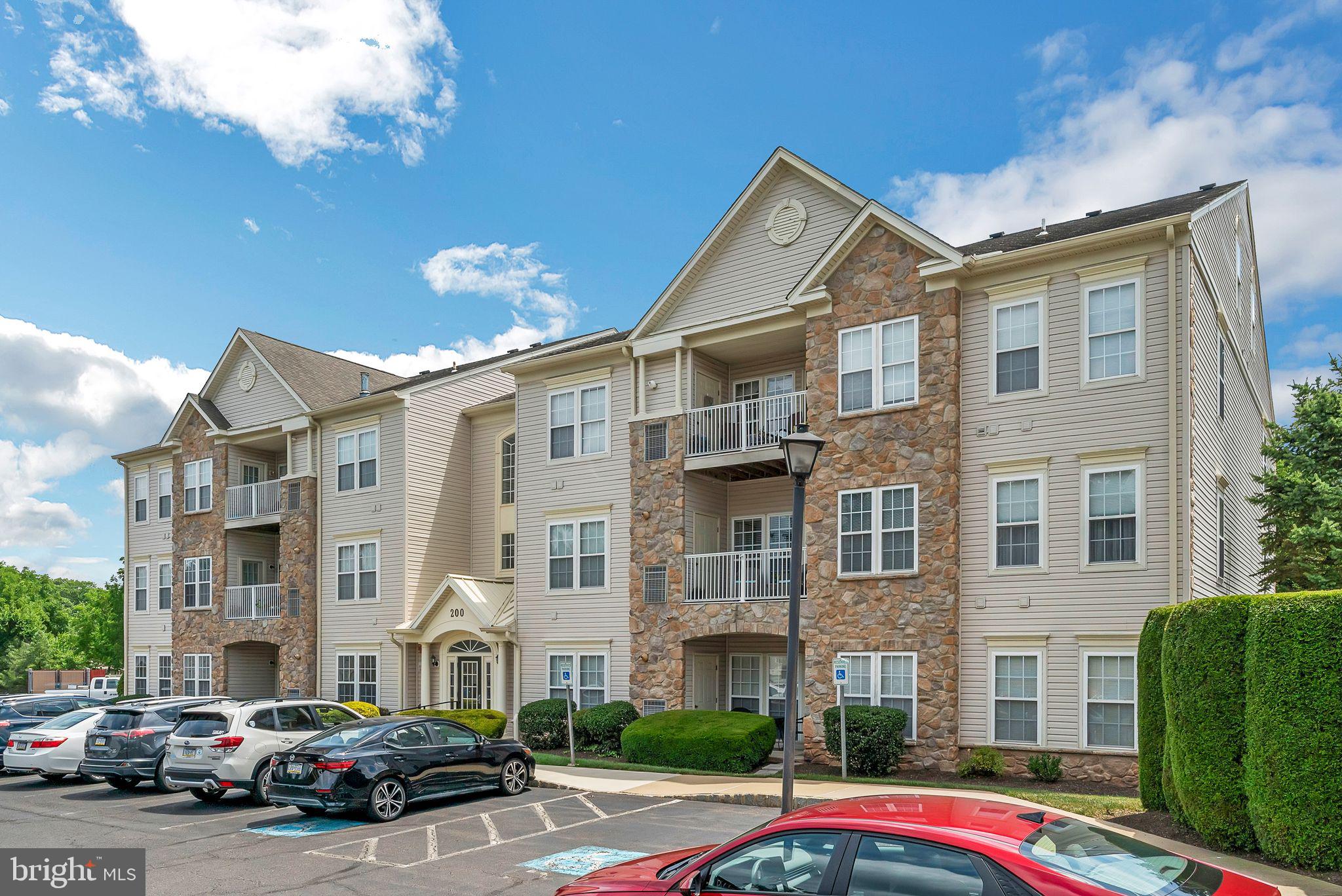 Welcome to Forest Ridge, an exclusive 55+ community where the active adult lifestyle is enhanced by modern amenities and low-maintenance living. This conveniently located, 1st floor, 2-bedroom, 2-bathroom unit is move-in ready! A foyer entry with double closets leads to an open concept living and dining room area filled with an abundance of natural light--high ceilings enhance the entire home. A centrally located kitchen features 42" cabinets, a breakfast bar, large pantry & access to the convenient in-unit laundry area. All appliances are included in the sale. The sunroom/den/breakfast room is the perfect place to enjoy your morning coffee and provides access to the private front patio. This premium location allows for direct entry from the parking lot, convenient for bringing in groceries and greeting guests. A spacious primary bedroom features walk-in closets and a private ensuite bathroom--complete with a double vanity, linen closet and stall shower. An additional well-appointed bedroom and full bathroom are located just off the front foyer. Common area/grounds maintenance, landscaping, snow removal, and trash removal are included in the monthly association fee. The community clubhouse is a hub of activity with a meeting room and event space, fostering an active and social lifestyle for residents. Pets are welcome. Shopping, dining, nightlife and community events are just minutes away on route 611 in Warrington and in historic Doylestown Borough. Book your private showing today!