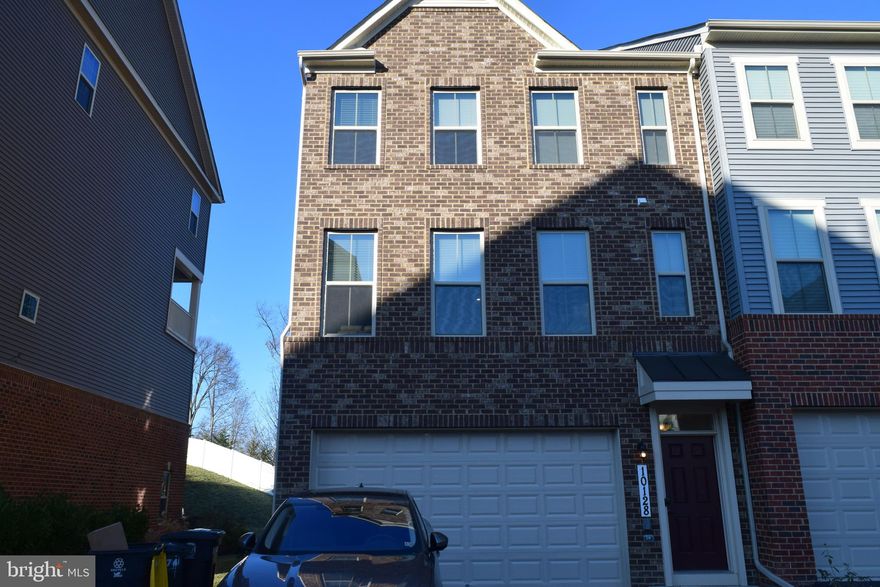 Welcome to 10128 Dorsey Lane in the subdivision of Glendale Crossing.  This brick front, end unit , 2 car garage, 4 level town home features 4 bedrooms and 4.5 bath.  Harwood floors on entry and 2nd level including stairs.  Kitchen features quartz countertops, 42 inch white cabinets with under-cabinet lighting, stainless steel appliances, quartz countertops, recess lighting throughout, butler's pantry, wood back splash, massive island, and fireplace.  The main level also includes pocket office.  Enjoy the deck off the kitchen with a gas fireplace with remote built-in.   The 3rd level, enter into the sun-drinched owner's suite with spacious walk-in closet.  Relax in the beautiful master bath with marble Roman shower and floors, quartz countertops with private water closet.  This level also features 2 generous size bedrooms with full bath, and laundry.  Laundry has state of the art GE washer and dryer.  4th level features large loft with bedroom and bathroom, and an entrance to the beautiful roof top deck.  Great for entertaining guess or in-law suite area
This home has to many features too list, close to shopping and commuter routes.  Community offers bike trail, parks, and community pavilion for gatherings.  Bring your pickiest buyer. They will not be disappointed.  Must SEE! Wont Last!