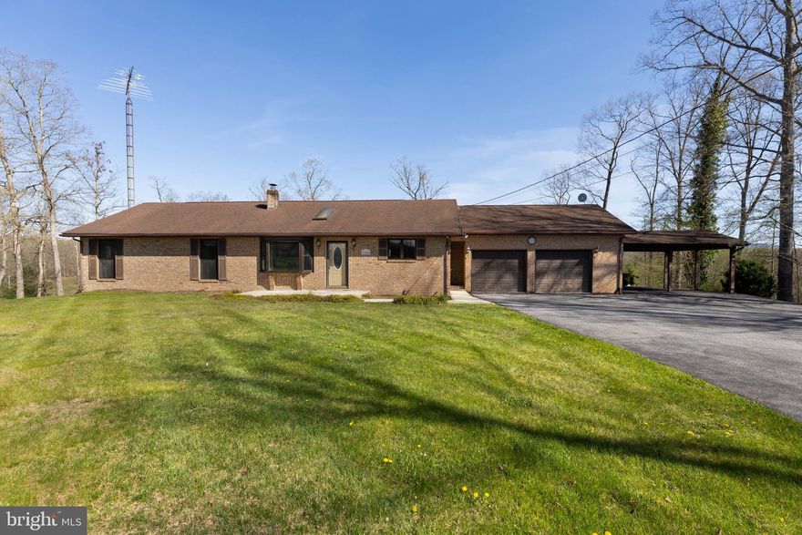 Experience the beauty of nature and the charm of yester years in this idyllic retreat, where comfort and style harmonize effortlessly. Perfectly set on 1.65 acres of serene woodland, this brick rancher is ideal for hosting family gatherings, weddings, or even graduations. With 3 bedrooms and 3.5 baths, plus a fully finished basement, this home provides ample space for relaxation and entertainment. The sunroom is the place to gather, flooded with natural light and offering picturesque views of the surrounding landscape. 

The retro styling evokes a sense of timeless comfort, while the two-car garage, shop and outbuildings provide practical storage solutions. With its wooded lot and captivating vistas, this property offers a tranquil escape from the hustle and bustle of modern life.

Imagine lazy afternoons, listening to the sounds of the forest and breathing in the fresh air. Whether you're enjoying the tranquility of the wooded lot or gathering loved ones for special occasions, this home offers a comfortable and inviting atmosphere.

Whether you're unwinding in the charming living spaces or exploring the wooded grounds, this home invites you to step back in time and embrace a simpler way of living.