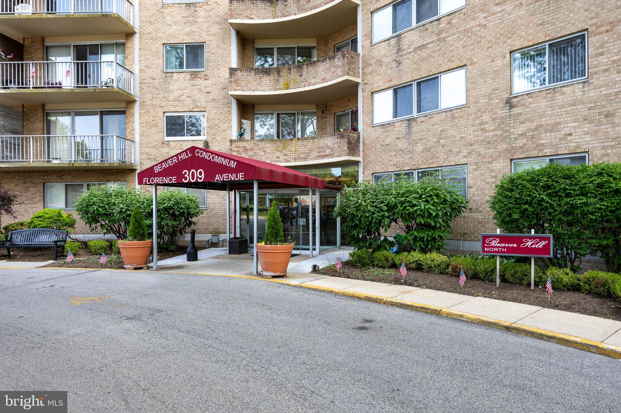 Welcome to easy living in this spacious 1,100 sq ft 1-bedroom, 1-bath condo at Beaver Hill North in desirable Jenkintown. This move-in ready home features classic parquet flooring, an updated bath, and a convenient kitchen. The large living room opens to a private balcony with abundant natural light and peaceful views of the pool and green space. Offering more square footage than many 2-bedroom units, this condo provides exceptional living space. The condo fee includes all utilities—heat, A/C, electric, gas, water—plus doorman service, van transportation, common area maintenance, snow and trash removal. Enjoy the beautiful community room, with optional access to the pool and fitness center for a small fee. Guest rooms and a private event room are available to rent. Additional storage is located in the building’s lower level. Just steps from the train, shopping, and dining. No pets permitted.