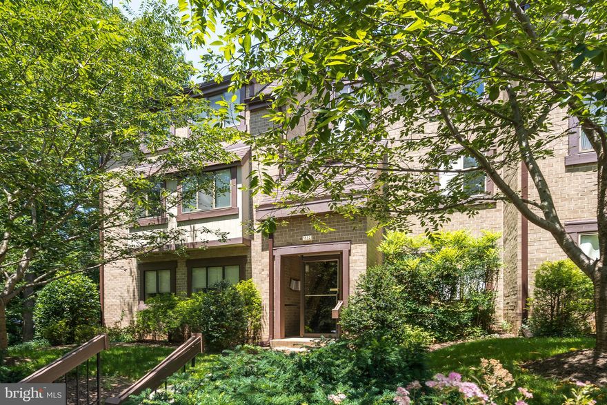 Top Floor Condo Living at its Best with all utilities included in the HOA fee!  As you enter the top floor unit of Parkcrest Circle, you ll find this elegant condominium with countless special features including the freshly painted "Agreeable Gray" walls. The open concept living with hardwood flooring convey a contemporary lifestyle. Entertain in the formal dining room or enjoy casual meals on the large balcony. The granite counters feel classy and contemporary, along with stainless steel appliances and abundant storage space the cabinets have to offer. Continuing down the hallway is an updated full bath and 2 large bedrooms with ample closet space. The HVAC has just recently been replaced and there is  a covered reserved parking space that conveys with the unit. Convenient to beautiful parks, Wiehle metro station and award-winning schools, this phenomenal condo has it all!