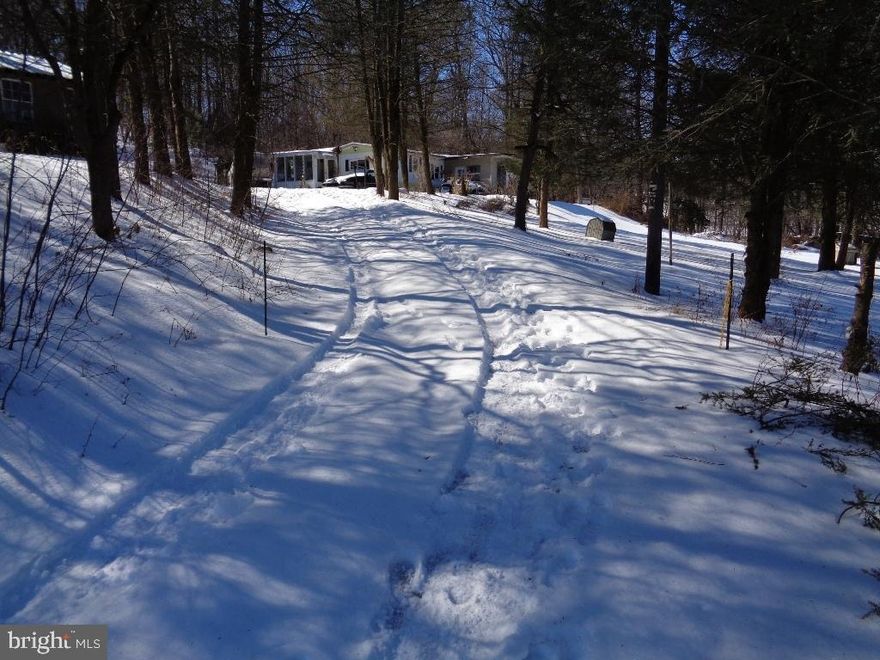 Beautiful land with septic & well. Mobile home is currently on property & lived in. Come build your dream home here!