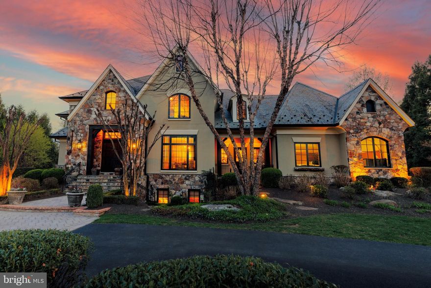 644 Deerfield Farm Court is a classically refined Great Falls oasis, meticulously reimagined with sophisticated craftsmanship and timeless elegance. Just under two acres with walkability to the Great Falls Village, that is hard to beat! Privately positioned on a tranquil cul de sac near Great Falls Village and River Bend Country Club, the home features over $2,000,000 in upgrades... handcrafted steel gates that open into your circular driveway, manicured landscaping, stucco and stone siding, copper gutters, and a slate roof. The resort style backyard showcases a saltwater pool, elevated veranda with portico, firepit, hot tub, and lush gardens of cherry blossoms and hydrangeas.

Inside, grand double doors open to 9,000 sq. ft. of luxurious living. The chefs kitchen boasts custom cabinetry, marble countertops, SubZero and Wolf appliances, and a 7-ft wine refrigerator. Formal and family rooms with fireplaces flow seamlessly outdoors, while the sunroom doubles as a world class office. The upper level hosts a primary suite with a private balcony, sitting room, dual sided fireplace, walk in closets, and spa bath, plus 3 additional ensuite bedrooms and laundry.

The lower level offers a custom mahogany bar, wine cellar with 200 year old refurbished door, media and game areas, gym, and guest suite (5th bedroom). Just blocks from Great Falls Elementary and a short walk to the Village Centre, this residence blends architectural mastery, resort-style amenities, and a premier location—redefining luxury living in Great Falls. Welcome home!