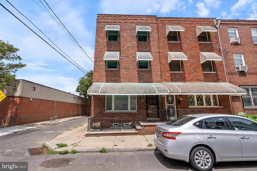 Gorgeous Corner Townhome with 1-car Off Street Parking in the Heart of the Passyunk Square neighborhood convenient to East Passyunk Avenue, the Stadium Complex, the 9th Street Italian Market, and Century City Philly! New Anderson Windows with quartz window sills! Basement - full and improved with rear storage room,  1/3 bath, side cellar gate, copper water service, partial new sewer line, 40 gal. gas hot water tank (5 yrs. Old), upgraded 200 Ampere electric service with separate 60 ampere electric service for the 3 rd floor, and Weil-McLain Direct Vent energy efficient gas heater with central air(Approximately 7 yrs old).  1st floor - Front Patio,  entry area, large living room/dining area combo with recessed lights, 2 ceiling fanlights, high ceilings, freshly painted walls, and oak and cherry hardwood floors; Custom extended  eat-in kitchen with  separately-controlled radiant heated ceramic tile floors, 4 yr. old Side-by-Side stailness steel refrigerator with ice and water Dispenser(GE Profile), Bosch Dishwasher(7 yrs. old), Center island, Custom-made UL cherry wood cabinets, GD, Blue Star gas hooded range, Quartz counter-tops, recessed lights, ceiling fanlight, Wolf microwave  oven and Wolf confection oven, and rear door to 1-car fenced off-street parking.  2nd floor - Two(2) nice-sized bedrooms with plenty of light, harwood floors, ceiling fanlights, sliding door closets, freshly painted walls, and more; Fabulous rebuilt/remodeled 3-piece with stack washer/dryer in laundry closet, sklylight, ceramic tile walls and floor, and custom vanity. 3rd floor - Main Bedroom/study suite with vaulted ceiling, skylight, recessed lights, 3 ceiling fanlights, hardwood floors, freshly painted walls and ceiling, ceramic tile powder room, sliding door closet, spearate 60 ampere electric service, plenty of light, and separate split ductt  HVAC system. New laundry sink and hookup in basement  This Home is a MUST SEE!