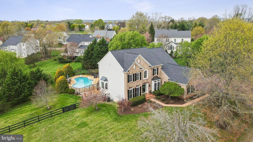 Welcome to your dream home in the sought-after Woods at Warrenton—an elegant colonial nestled on over half an acre of beautifully landscaped, private, and fully fenced grounds. From the moment you arrive, you’ll be captivated by the serene setting and luxurious amenities this home has to offer.
Step into the backyard oasis where you’ll find a gorgeous in-ground pool, a spacious deck perfect for entertaining guests, viewing sunsets, and a custom patio ideal for an evening fire and stargazing.
Inside, the home boasts a thoughtfully designed layout with hardwood floors throughout the main level. A private study with French doors provides a quiet workspace, while the oversized family room offers plenty of room to unwind. The gourmet kitchen is a chef’s delight, featuring a large island and seamless flow into the sun-drenched breakfast room.
Upstairs, the luxurious primary suite is a true retreat with tray ceilings, organized walk-in closets, and a recently renovated spa-like bathroom offering a tranquil escape. Three additional well-sized bedrooms complete the upper level, along with a beautiful new hall bath- perfect for family and guests.
The fully finished basement is designed for fun and functionality with a custom bar, game area, spacious rec room, and updated full bath. A convenient mudroom with snack bar and refrigerator leads directly to the backyard and pool area for easy indoor-outdoor living.
All of this, just minutes from downtown Warrenton’s charming shops, restaurants, and local attractions—offering both peaceful privacy and everyday convenience.