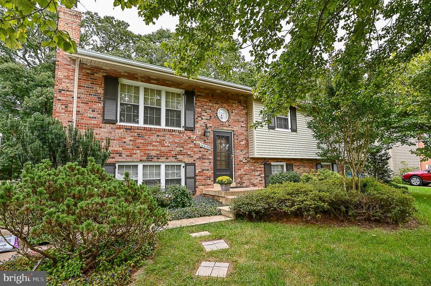 Beautiful home backing to woods! Main level features hardwood throughout,  formal living and dining rooms, fresh paint,  bright kitchen, primary bedroom w en suite bath,  and two other nice sized bedrooms.  Spacious lower level with new carpet, fresh paint, wood burning fireplace, 4th bedroom , private office, and full bath. Brand new deck overlooks beautiful backyard backing to private wooded area.