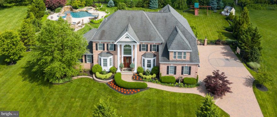 Breathtaking custom designed estate home graces1.1 acres of lush landscape on a private cul-de-sac, in desirable Woods of Northampton. This grand estate, featuring 5 bedrooms and 4.5 baths, overflows with the finest, top-of-the line materials and amenities meticulously executed. Grand living spaces offer an open and airy floor plan. Sophisticated solid wood cabinetry, high-end finishes, intricate crown moldings, hardwood flooring throughout, elegant window treatments and solid wood cabinetry appoint the interior living space of this elegant home. Special highlights include a spectacular lower level with a nine-foot ceiling, cinema theater, custom wine cellar, grand bar area, game room, steam room, with a walkout to an impressive extra-wide blue stone patio. In addition, there is a distinctive conservatory featuring plantation shutters, a children's play area, and a cozy sitting area.  Outdoor amenities include an extravagant backyard featuring an amazing outdoor kitchen, a heated saltwater Gunite swimming pool and spa, and a custom-built wood-burning fireplace designed to complement both the pool and home's design. Outdoor highlights are surrounded by meticulously manicured landscaping and stone pavers on the driveway that create a stylish curb appeal. In the prestigious Council Rock SchoolDistrict, close to restaurants, Tyler State Park andVillage of Newtown with easy access toPhiladelphia, New Jersey and New York.