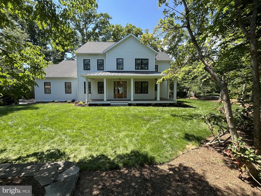 Stunning new craftsman style home in the heart of Fort Hunt's Waynewood school district. A striking exterior with black windows, white siding, and standing seam metal roof harken back to a bygone area. Sited impressively on a corner lot, this home says "home." Step inside and find anything but the ordinary. Large open layout allows for casual space for daily life while providing seamless flow for large-scale entertaining. Soaring ceilings, hardwood flooring and built-ins all combine to provide the character you want. Huge chef's kitchen is the heart of the home with 48" range, built in refrigerator and tons of custom cabinetry. Butler's and separate large pantry room ensure you have plenty of space to serve guests and hosts functions. The main level also has a large mudroom with built-ins, bedroom with ensuite bathroom (easily used as an office) and telescoping doors that allow the outdoors in on your glorious deck. Upstairs, there are 4 generous bedrooms with walk-in closets, hardwood floors, and 3 full bathrooms. A spacious laundry room also helps keep the clothes where they belong. The primary suite is well appointed with extensive moldings, gorgeous white oak flooring, and relaxing sitting room, two walk in closets and a lux marble bath with dual sinks and soaking tub. With so much space, it's easy to focus on preparing and unwinding from your day. The lower level has a large recreation room, work-out room, 6th bedroom, 5th full bathroom and tons of storage space. A second gas fireplace adds comfort and ambiance to this level.

Outside, you will find yourself within walking distance to Fort Hunt's local shopping. Drycleaning, grocery, pharmacy, a hardware store and a variety store are all just a block away. The GW Parkway with it's miles of bike trails and Potomac River views are just up the street. 

Welcome Home!