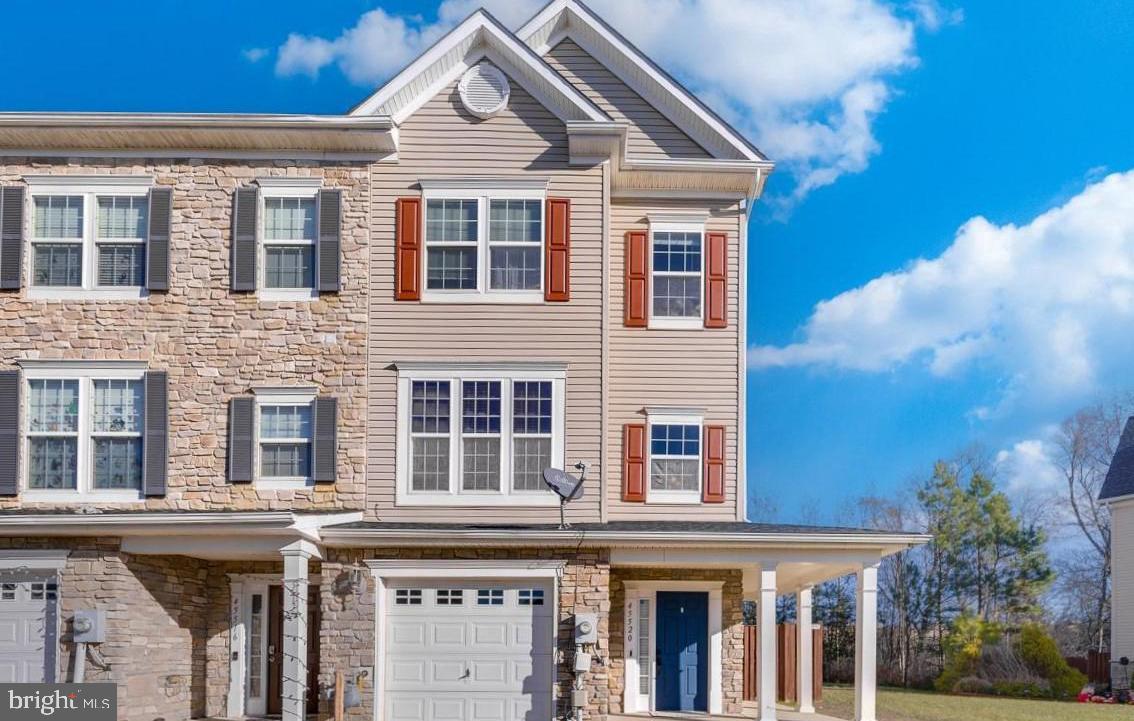 Welcome to this beautiful end unit town home, offering over 2500 square feet of living space. As you approach, you're greeted by a quaint wrap-around porch, perfect for enjoying the outdoors. You can enter either through the porch or the front-facing garage, adding to the convenience. Upon entering the main level, you're welcomed into an open theater room. This room features a projector television, creating a cozy space for entertainment. There is also a bathroom for added convenience. Towards the rear of this level, a sliding glass door leads to the fenced-in backyard with a patio, extending your living space outdoors. Moving to the second floor, you'll find hardwood floors that add warmth to the space. The open floor plan on this level includes a kitchen and dining area, offering plenty of space for dining and entertaining guests. Ascending to the next level, you'll discover the owner's suite with cathedral-height ceilings which makes it feel even more spacious. There is a walk-in closet and a secondary closet which provides ample storage space. The en-suite bathroom features a large sunken tub, perfect for relaxing, as well as a separate shower stall. This home is also conveniently located close to restaurants, shopping, Patuxent River Naval Base and walking trails, offering the perfect blend of comfort and convenience for its residents. * Water heater is 3 months old.