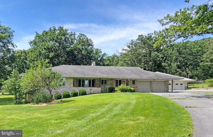 SOLID STONE RANCHER ON BEAUTIFUL HOMESIGHT- 16 acres & ohh an 8 car garage for the automobiles!...   Many possibilities, Rt30 Frontage... Minimum zoning!!  Fenced garden area, two ponds & greenhouse.  Turkey and Deer in the area.  Situated on 2 parcels,  includes supersized (40x86) garage/ workshop!  Offers 4 large bedrooms and Huge lower level family room/with unique 3 sided stone fireplace!   LIVE HERE, WORK HERE, PLAY HERE!  So much space & views everywhere!  Close to golfing, Bedford shops & restaurants!  Solid home...Many possibilities & additional acreage available!  Space for everyone and your business too!  Easy highway access, 4 miles from Breezewood/I-70 interchange.